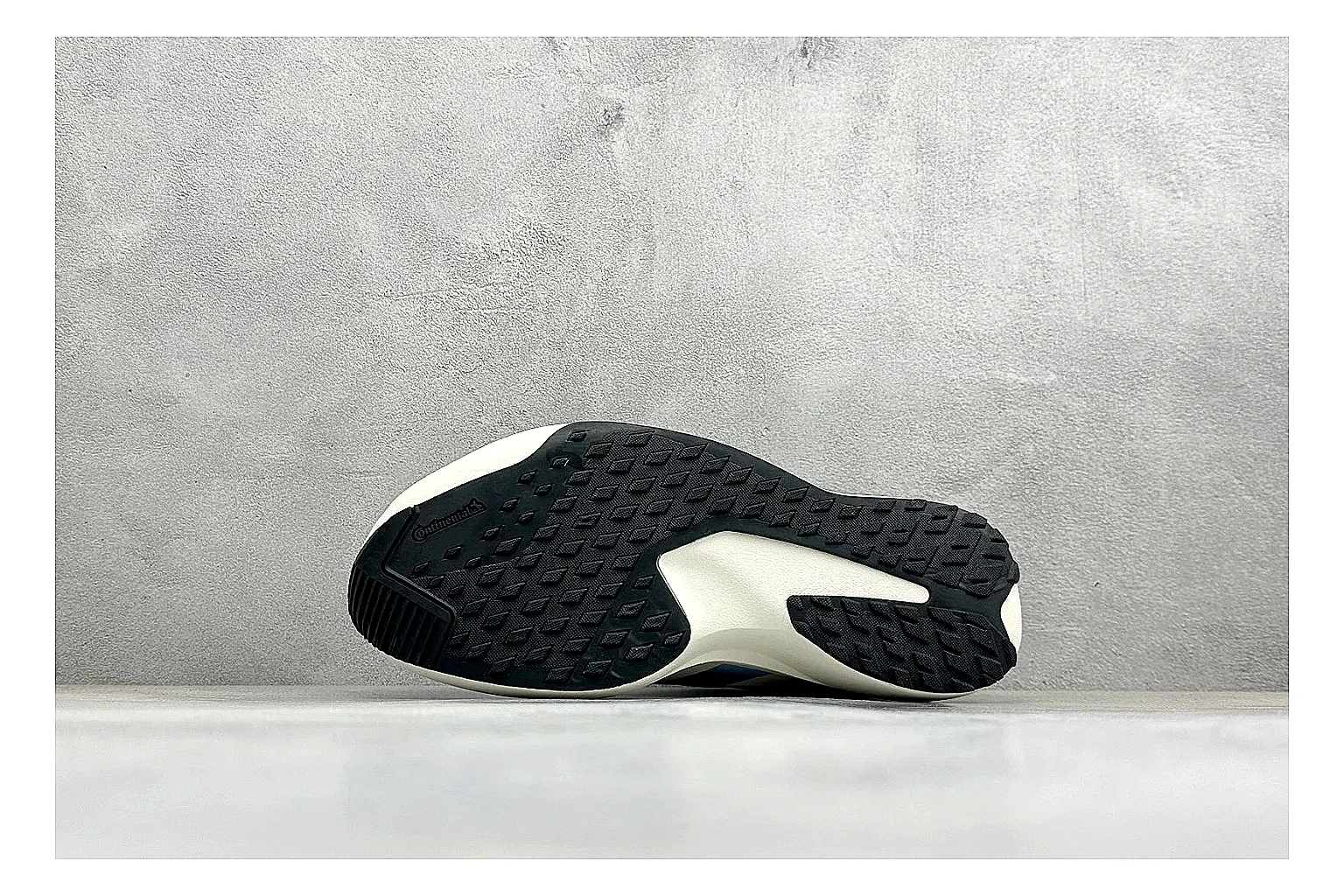 Adidas Adizero Evo Black comparison photo showing black racing upper, sculpted white sole, Adidas striping, and lightweight performance silhouette thumbnail 4