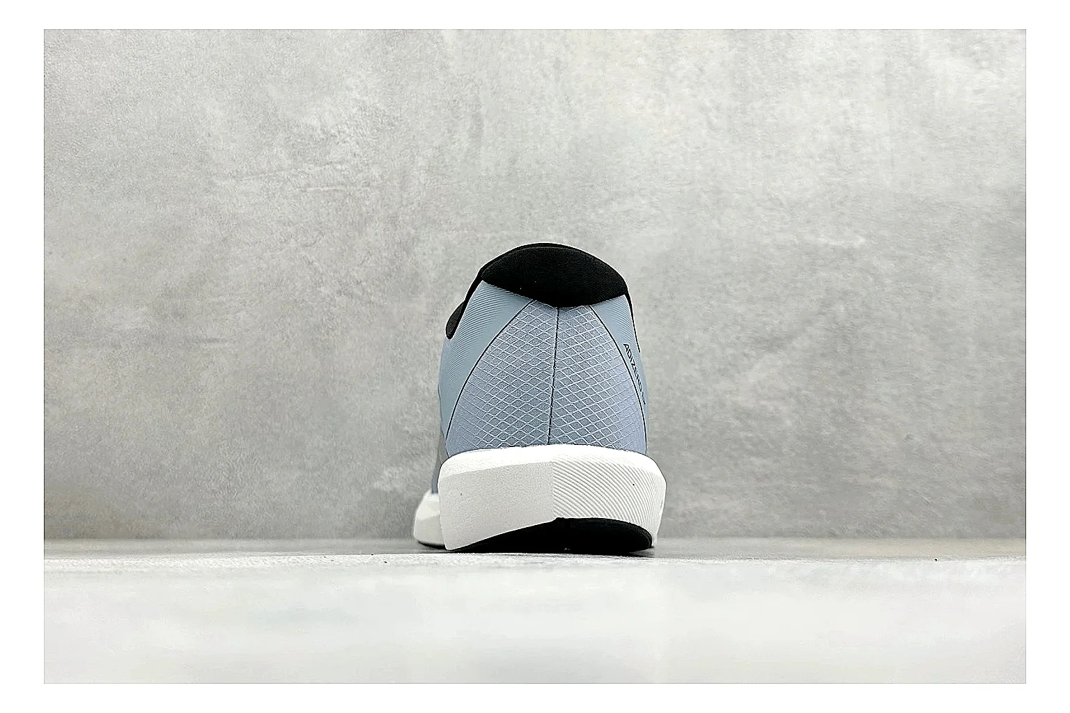 Adidas Adizero Grey Blue comparison photo showing grey lightweight runner upper, blue Adidas striping, slim racing shape, and low performance sole thumbnail 3