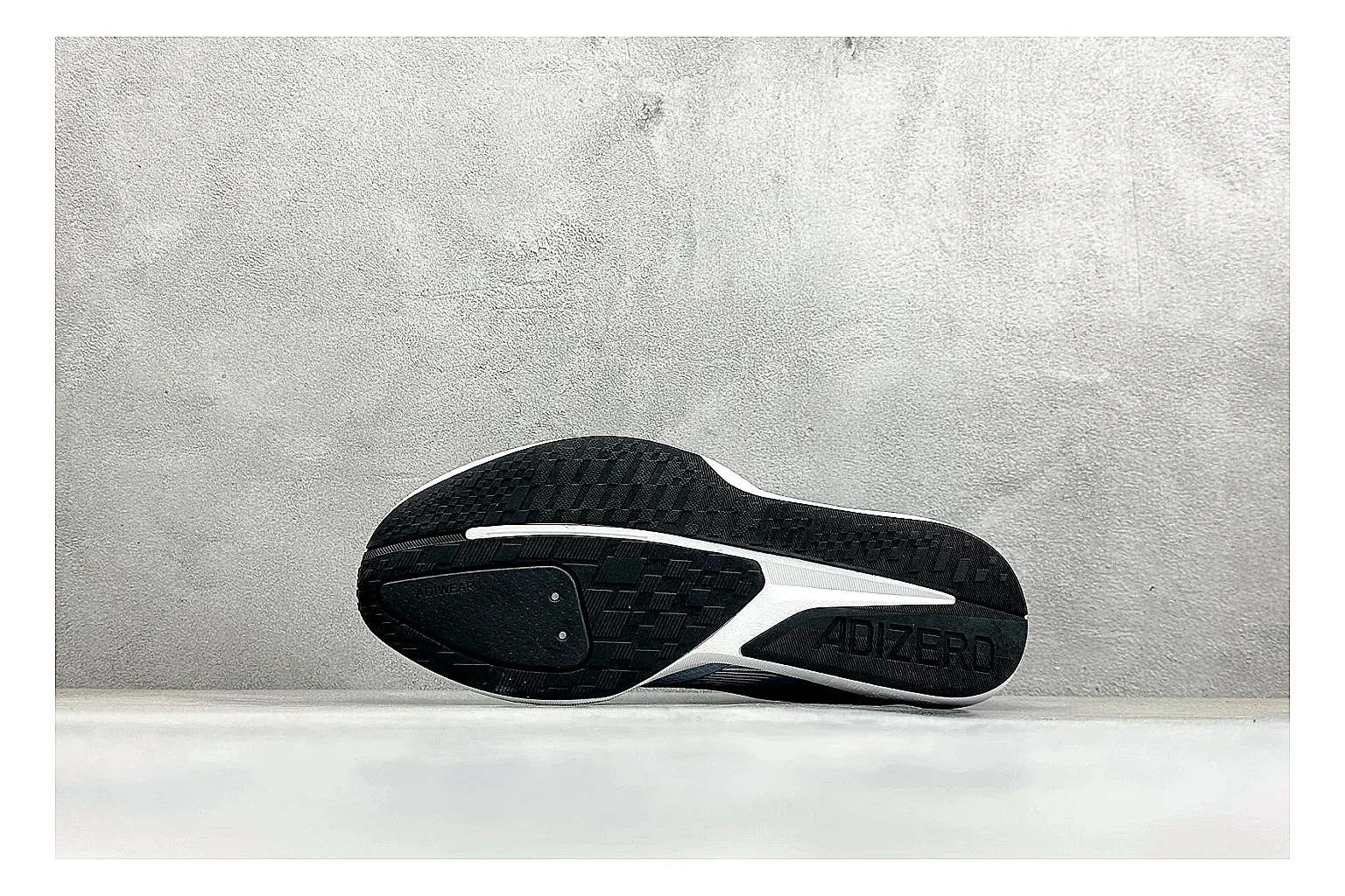 Adidas Adizero Grey Blue comparison photo showing grey lightweight runner upper, blue Adidas striping, slim racing shape, and low performance sole thumbnail 4