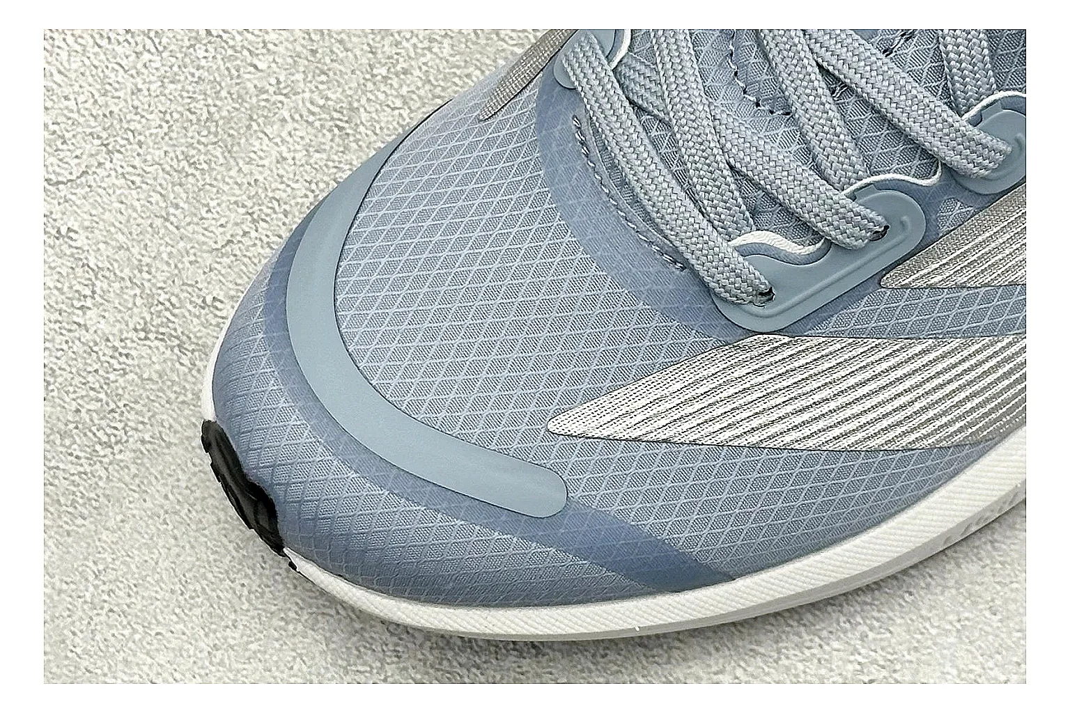 Adidas Adizero Grey Blue comparison photo showing grey lightweight runner upper, blue Adidas striping, slim racing shape, and low performance sole thumbnail 5