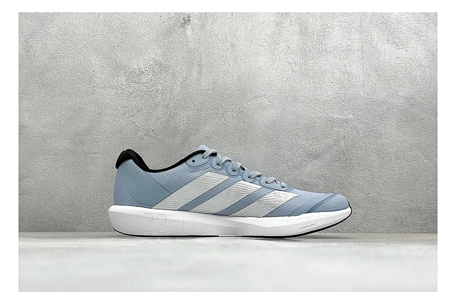 Adidas Adizero Grey Blue comparison photo showing grey lightweight runner upper, blue Adidas striping, slim racing shape, and low performance sole thumbnail 6