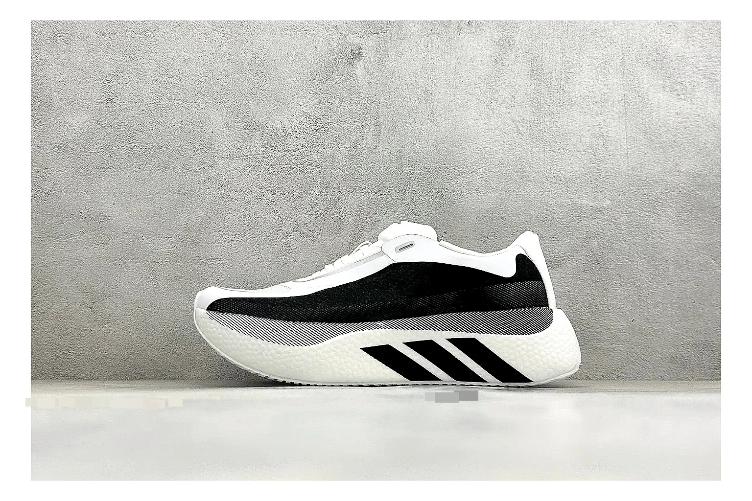 Adidas Hyper Boost White Black comparison photo showing white knit runner upper, black Adidas striping, sculpted Boost-style sole, and modern low runner profile