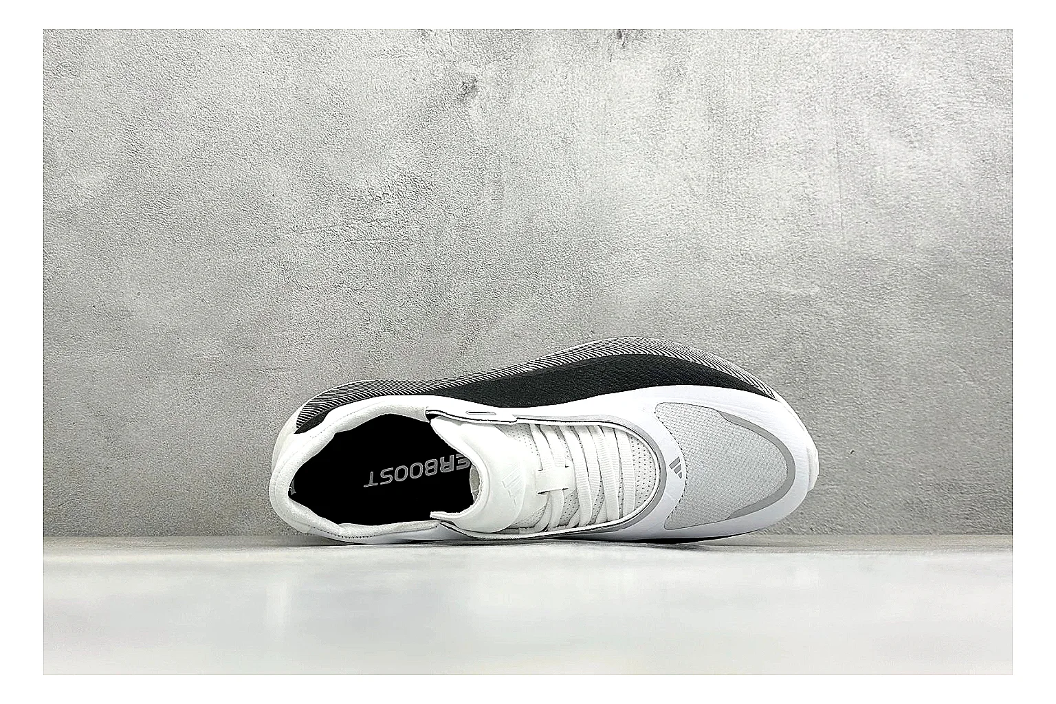 Adidas Hyper Boost White Black comparison photo showing white knit runner upper, black Adidas striping, sculpted Boost-style sole, and modern low runner profile thumbnail 2
