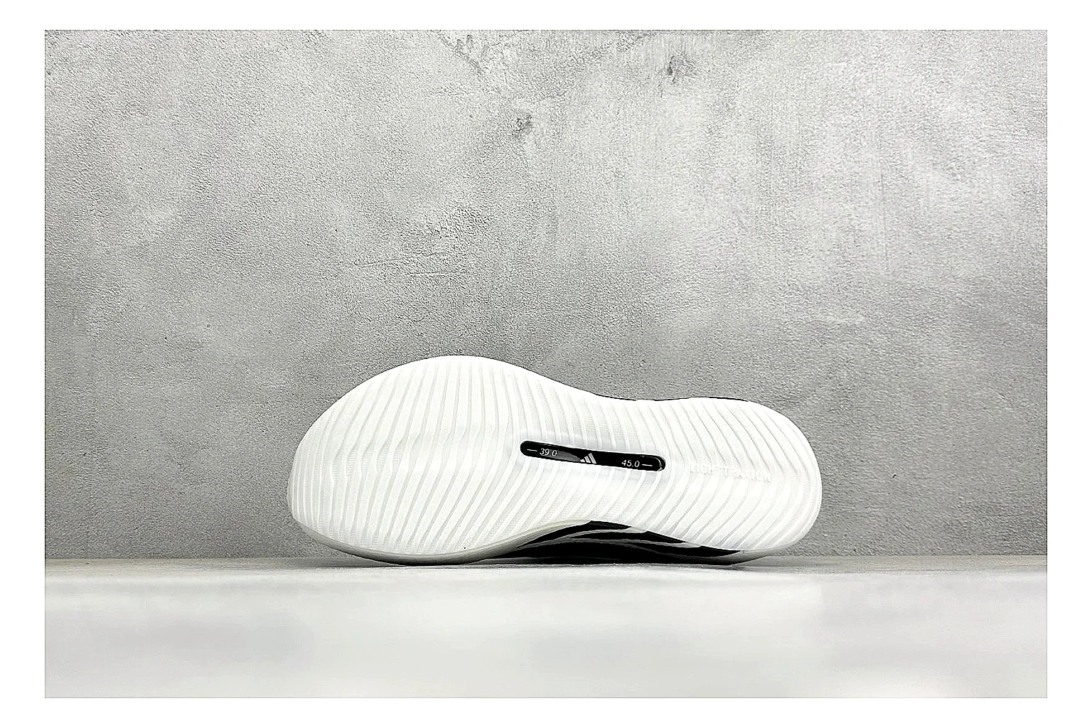 Adidas Hyper Boost White Black comparison photo showing white knit runner upper, black Adidas striping, sculpted Boost-style sole, and modern low runner profile thumbnail 4