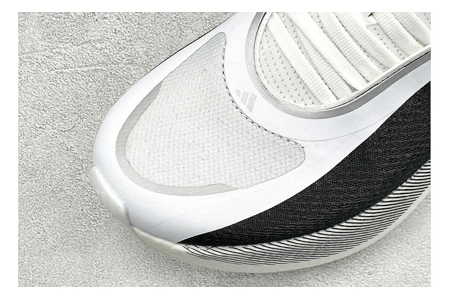 Adidas Hyper Boost White Black comparison photo showing white knit runner upper, black Adidas striping, sculpted Boost-style sole, and modern low runner profile thumbnail 5