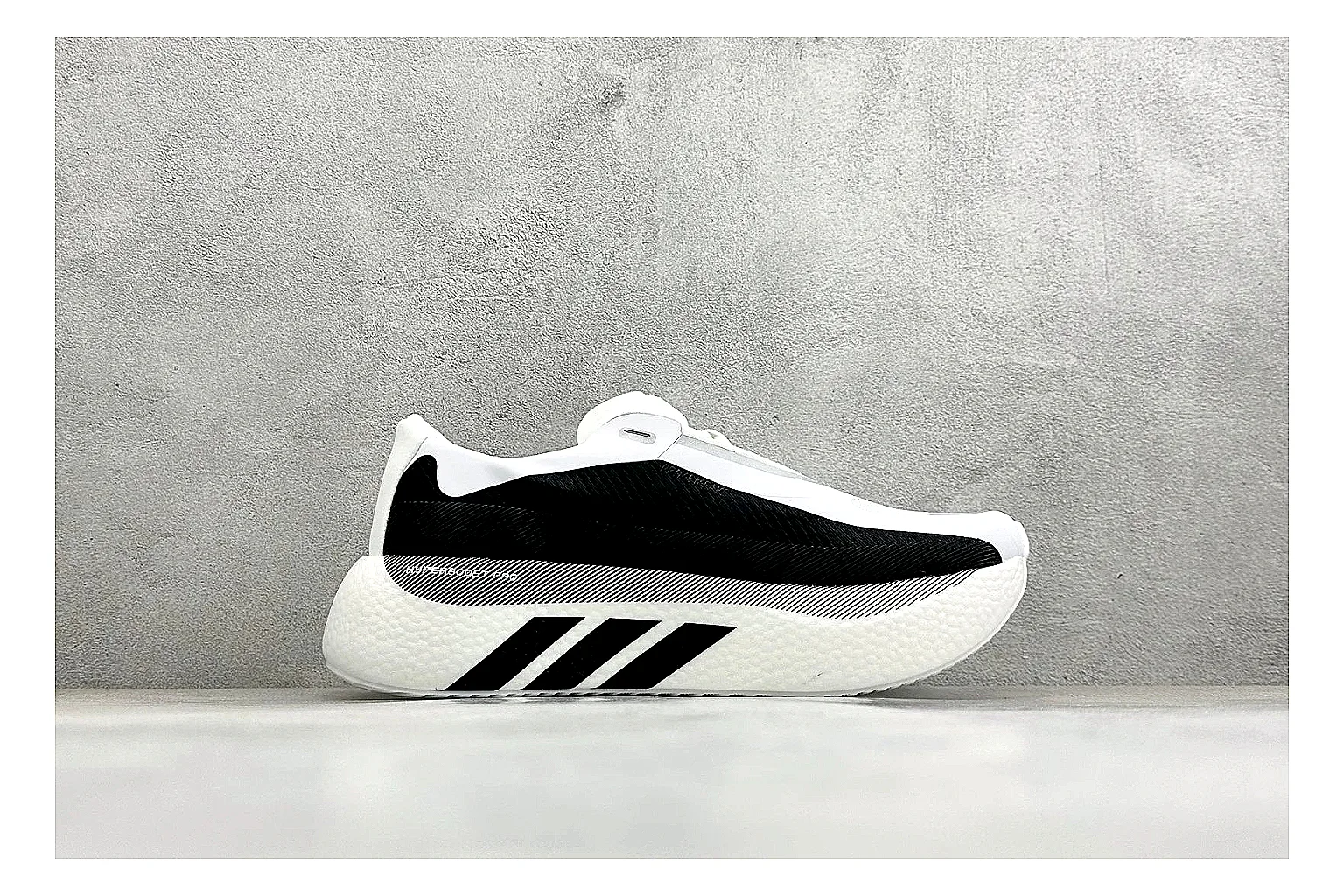 Adidas Hyper Boost White Black comparison photo showing white knit runner upper, black Adidas striping, sculpted Boost-style sole, and modern low runner profile thumbnail 6