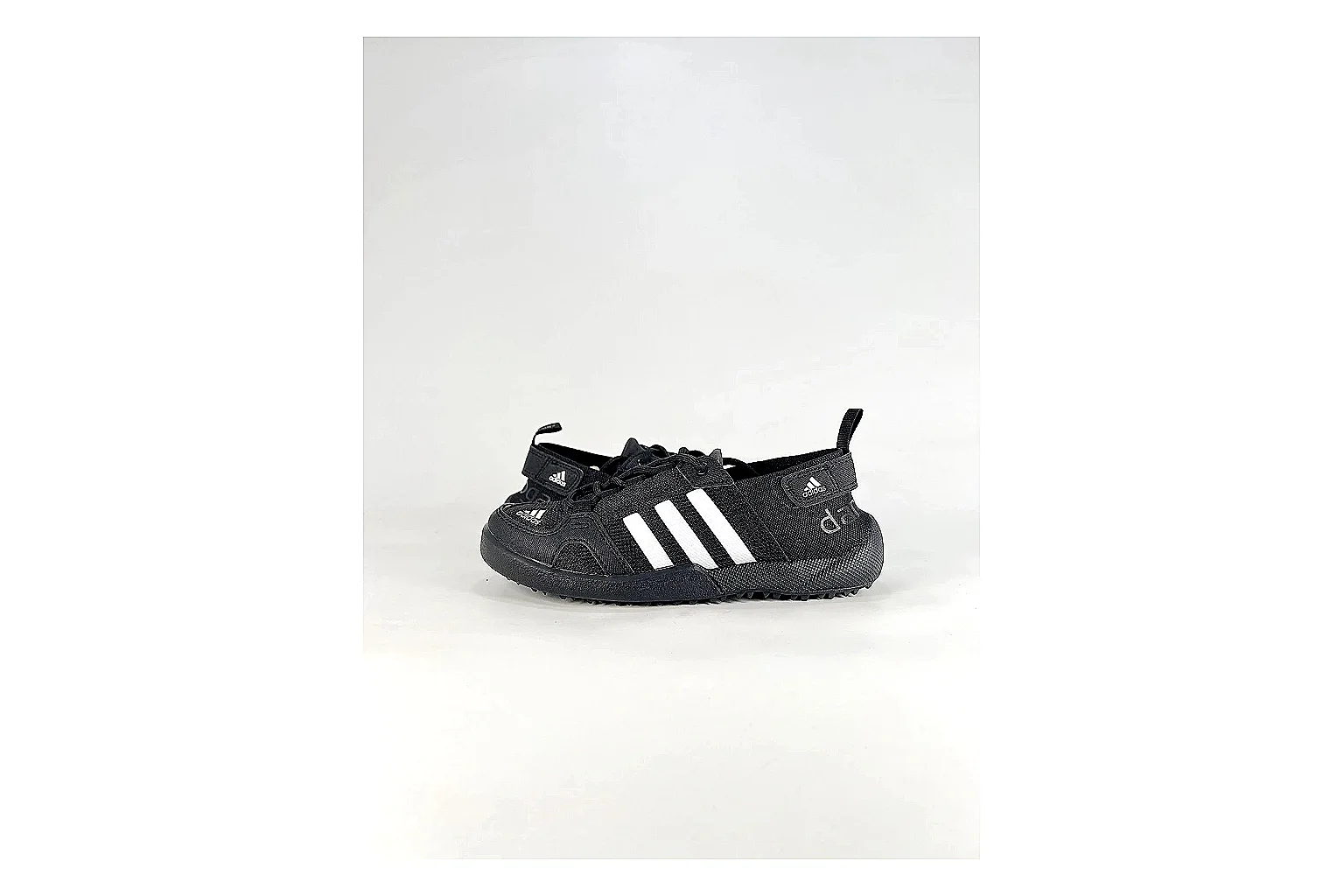 Adidas Originals Daroga Black White Sneakers comparison signal photo with black white low-top sneakers with mesh texture, side-profile shape, upper panel lines, and outsole detail