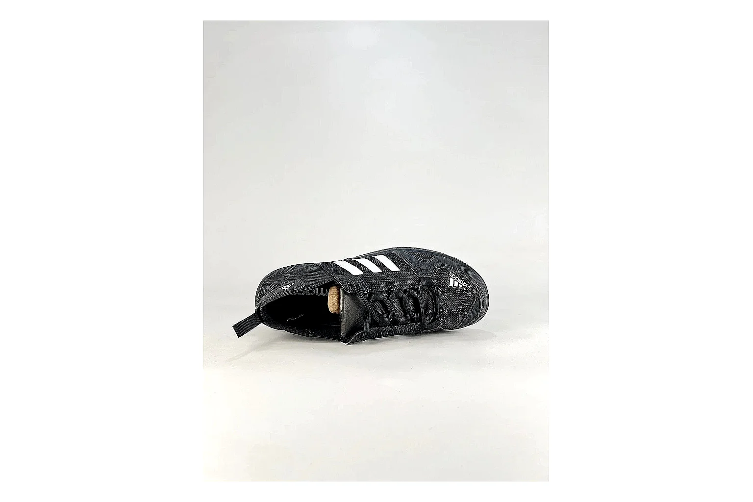 Adidas Originals Daroga Black White Sneakers comparison signal photo with black white low-top sneakers with mesh texture, side-profile shape, upper panel lines, and outsole detail thumbnail 2