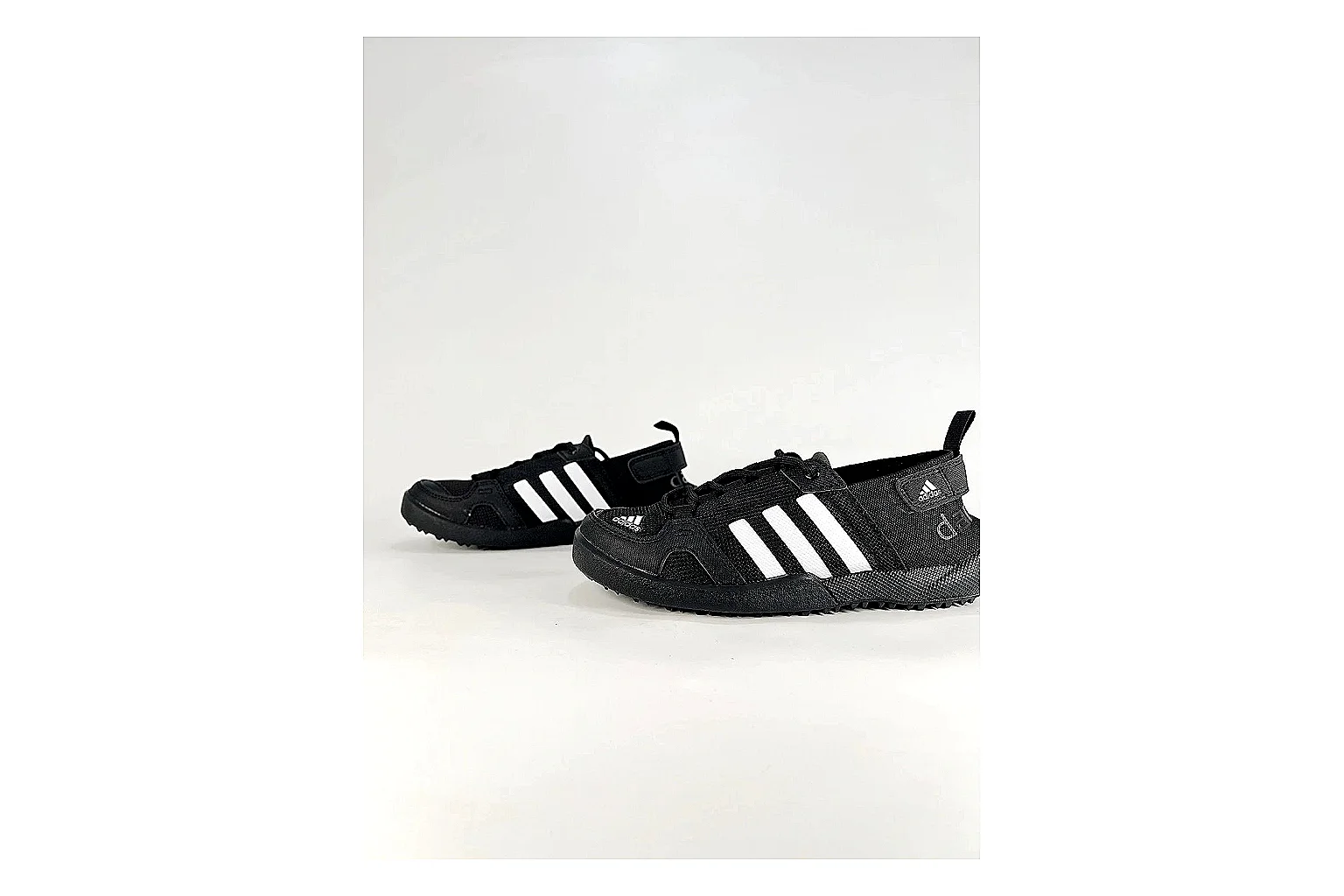 Adidas Originals Daroga Black White Sneakers comparison signal photo with black white low-top sneakers with mesh texture, side-profile shape, upper panel lines, and outsole detail thumbnail 5