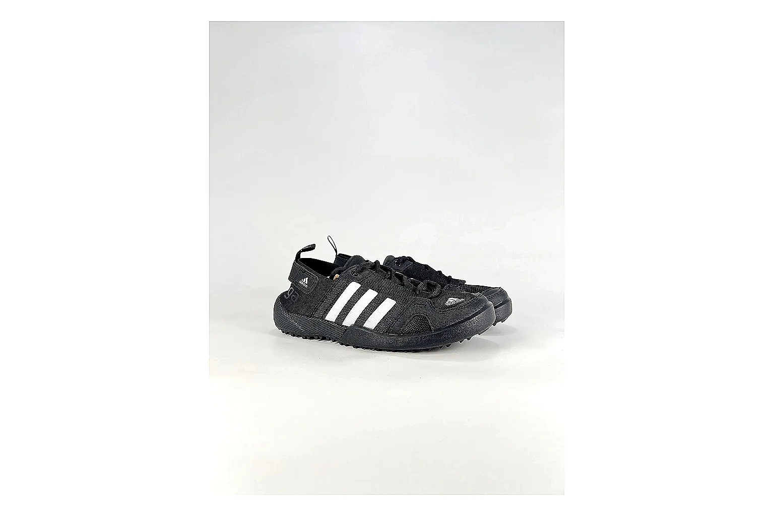 Adidas Originals Daroga Black White Sneakers comparison signal photo with black white low-top sneakers with mesh texture, side-profile shape, upper panel lines, and outsole detail thumbnail 6