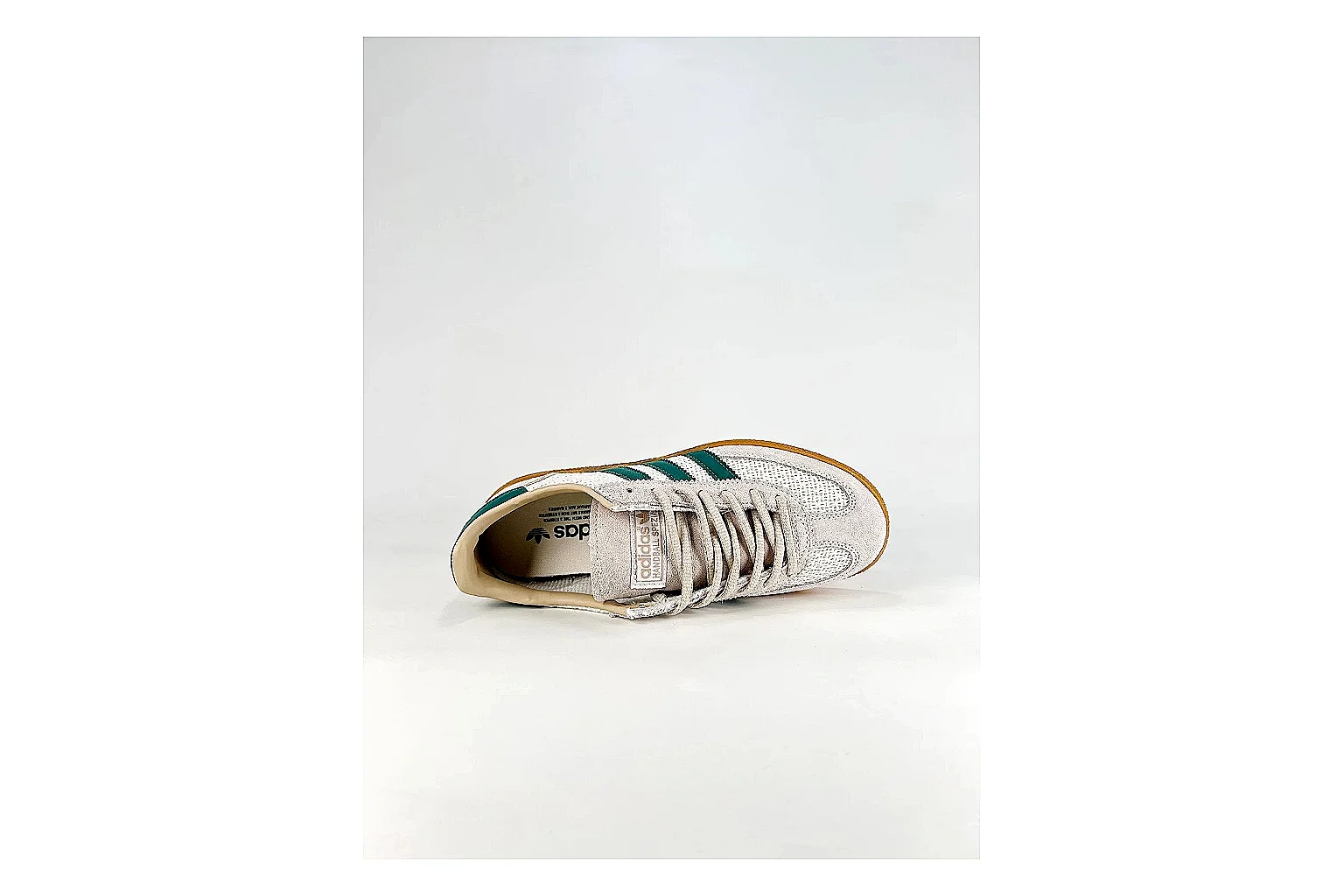 Adidas Originals Handball Spezial White Green Sneakers comparison signal photo with white green handball sneakers with suede-leather texture, side-profile shape, upper panel lines, and outsole detail