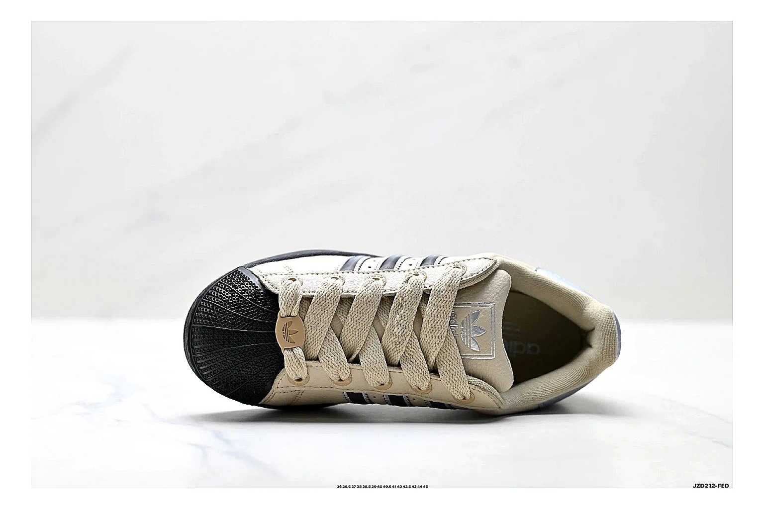 Adidas Originals Samba Cream Black Sneakers comparison signal photo with cream black terrace sneakers with leather texture, side-profile shape, upper panel lines, and outsole detail