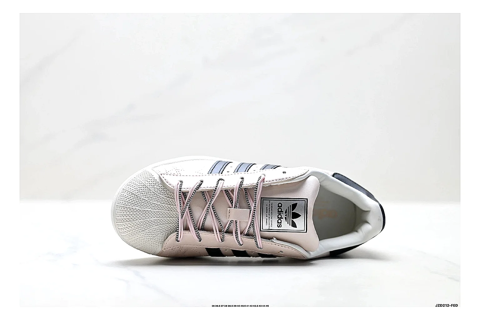 Adidas Originals Samba White Pink Sneakers comparison signal photo with white pink terrace sneakers with leather texture, side-profile shape, upper panel lines, and outsole detail