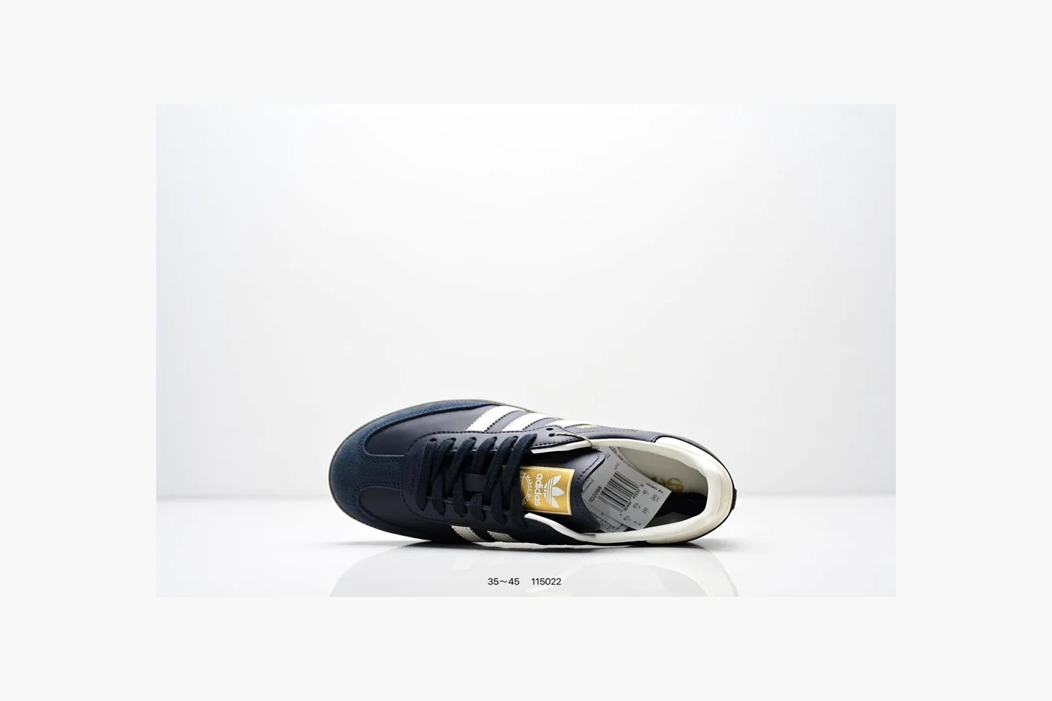 Adidas Samba OG Black White Gold comparison photo showing black leather-suede low-top upper, white three stripes, gold tongue label, gum sole, and classic Samba side profile