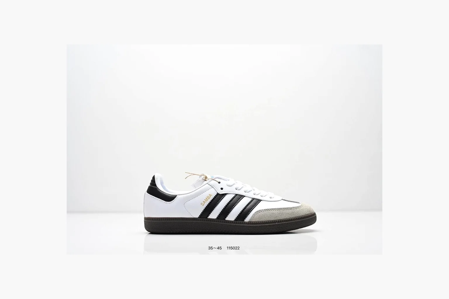 Adidas Samba OG White Black Blue comparison photo showing white leather-suede low-top upper, black three stripes, blue heel detail, gum terrace sole, and slim Samba profile