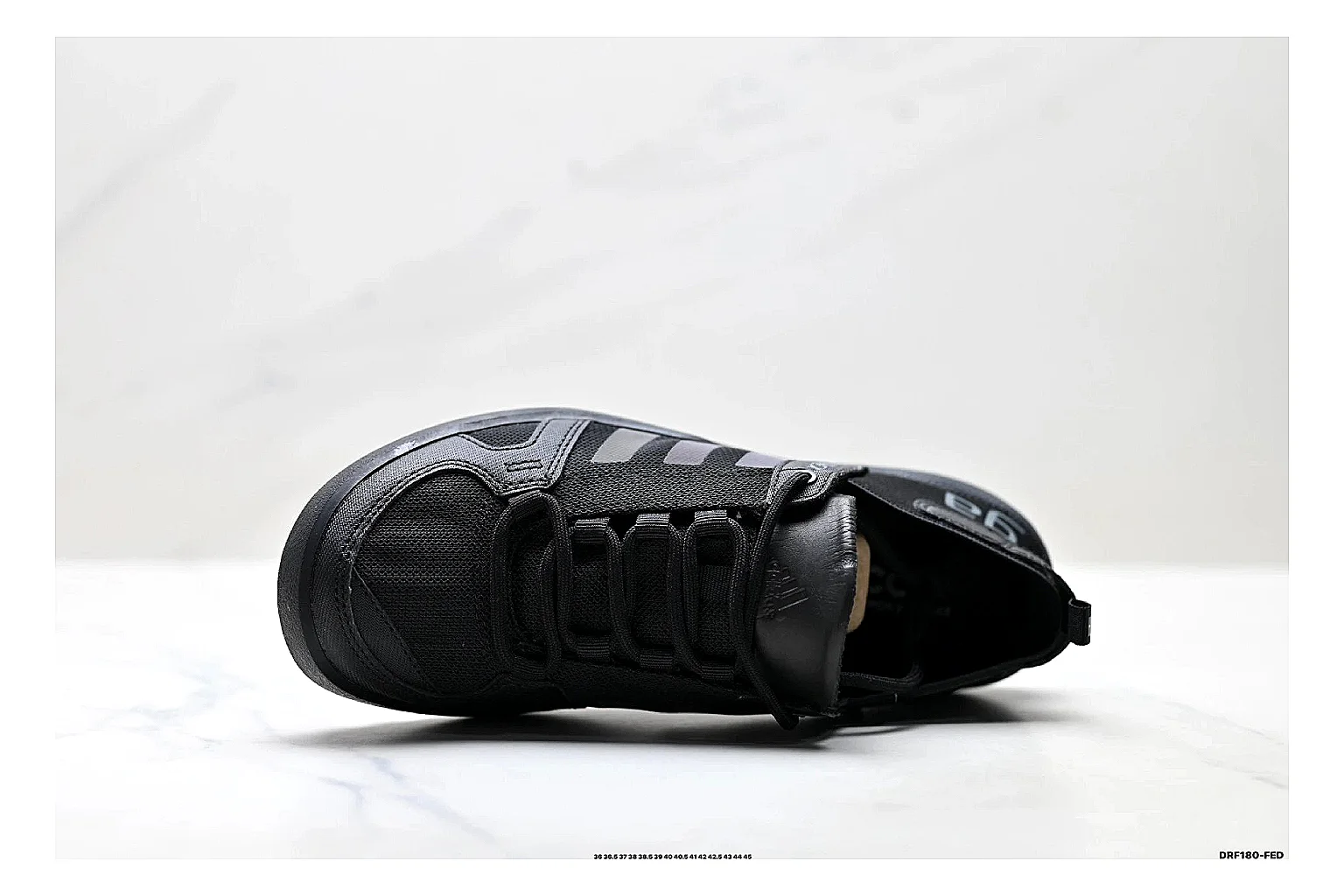 Adidas Terrex Daroga Black Sneakers comparison signal photo with black outdoor trail sneakers with mesh texture, side-profile shape, upper panel lines, and outsole detail thumbnail 2