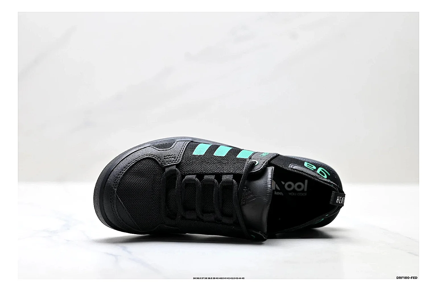 Adidas Terrex Daroga Black Green Sneakers comparison signal photo with black green outdoor trail sneakers with mesh texture, side-profile shape, upper panel lines, and outsole detail