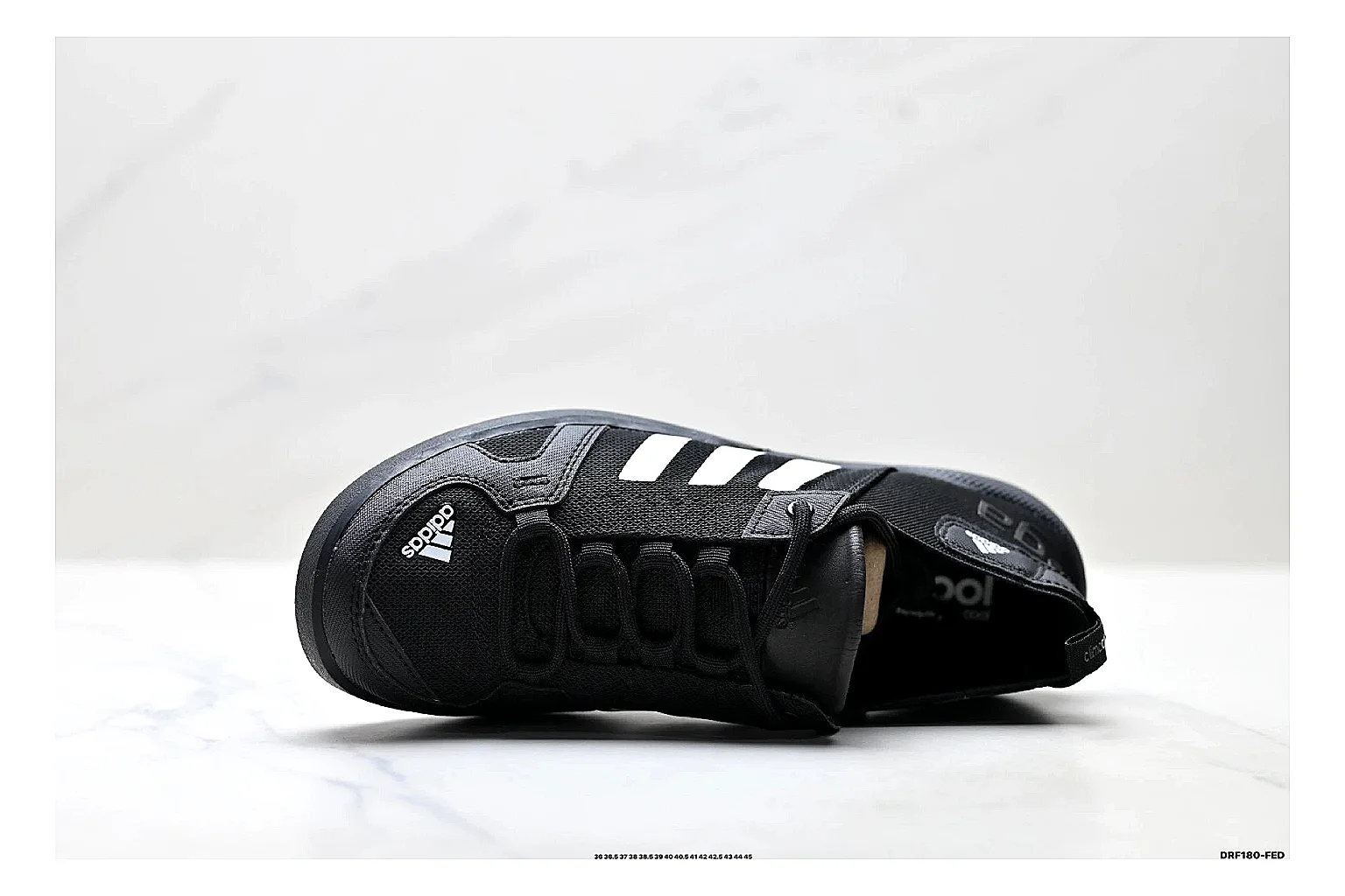 Adidas Terrex Daroga Black White Sneakers comparison signal photo with black white outdoor trail sneakers with mesh texture, side-profile shape, upper panel lines, and outsole detail