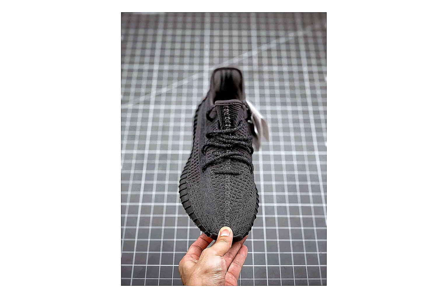 Adidas Yeezy 350 Boost Black comparison signal photo with black yeezy 350 knit runner with knit upper and knit shape