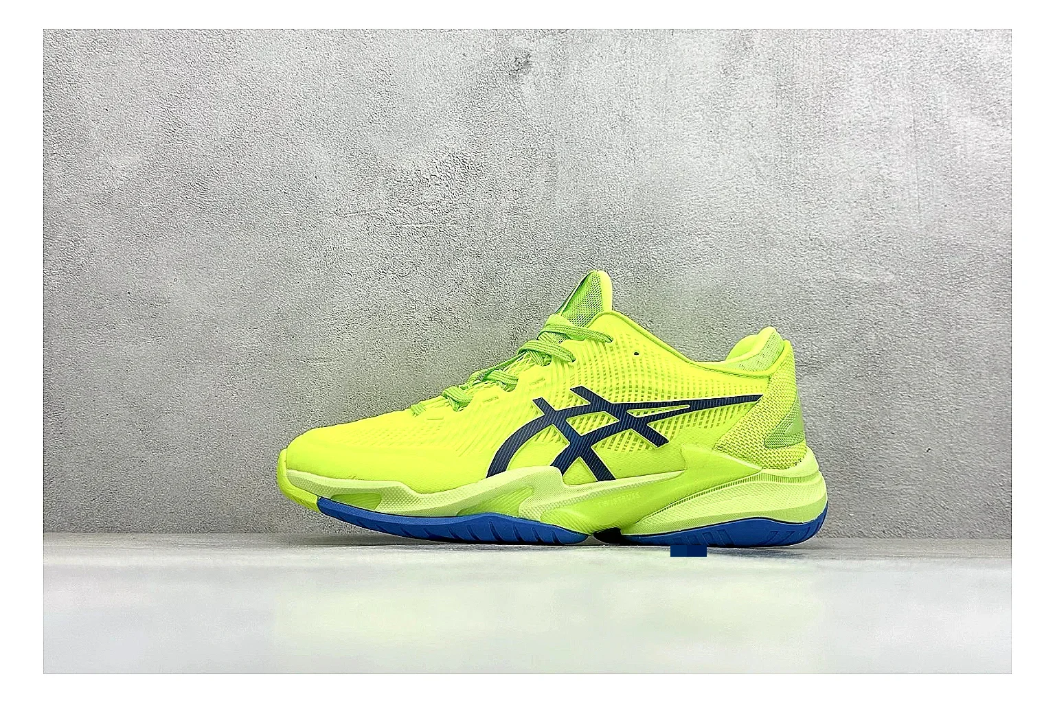 Asics Court FF Volt Blue comparison photo showing bright volt and blue court upper, supportive sole wall, Asics side lines, and stable tennis profile