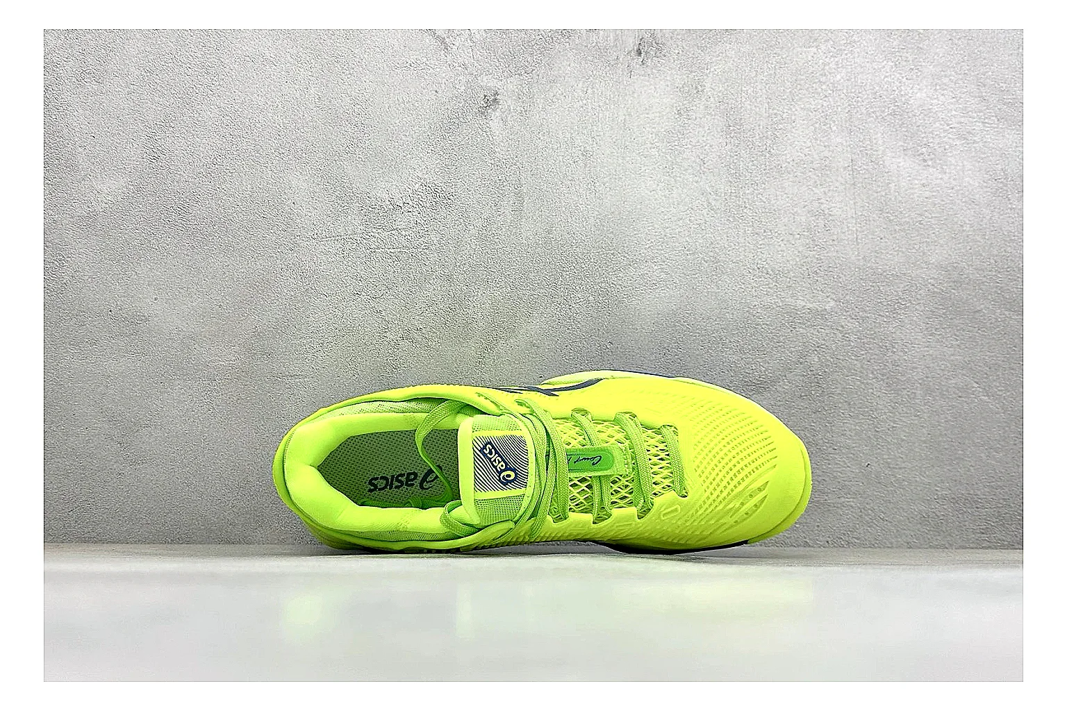Asics Court FF Volt Blue comparison photo showing bright volt and blue court upper, supportive sole wall, Asics side lines, and stable tennis profile