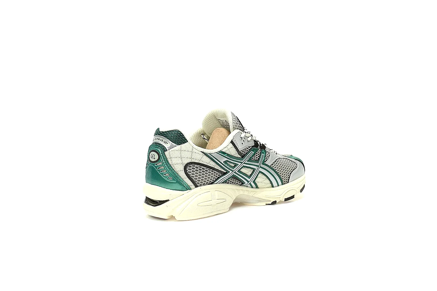 ASICS teal and silver runner with visible side branding and sculpted white sole