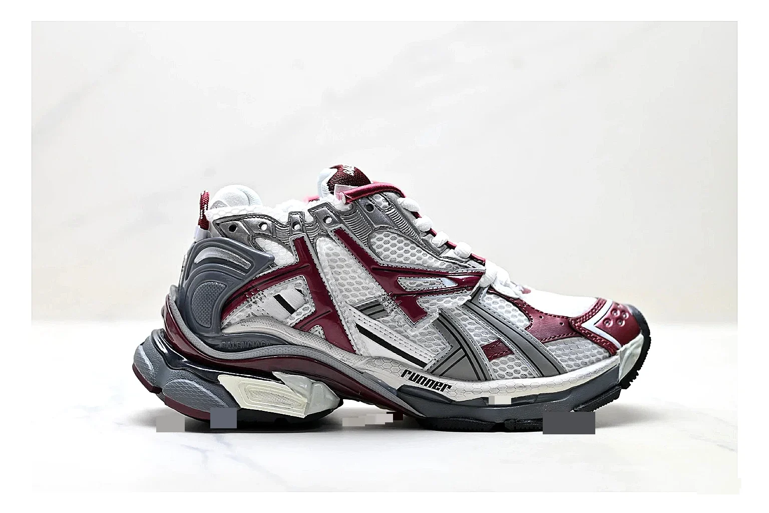 Asics Gel Runner Gray Burgundy comparison photo showing gray mesh-leather runner upper, burgundy Asics accents, retro runner shape, and cushioned sole
