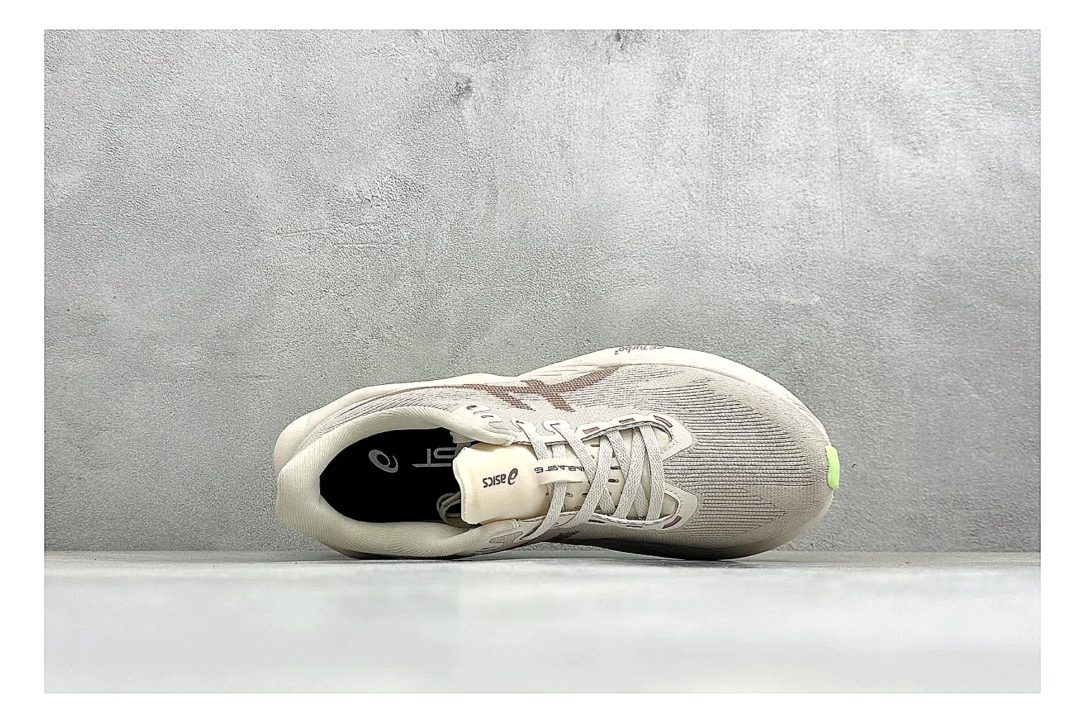 Asics Novablast 6 Cream Green comparison photo showing cream running mesh, green side accents, tall cushioned sole, and modern training silhouette