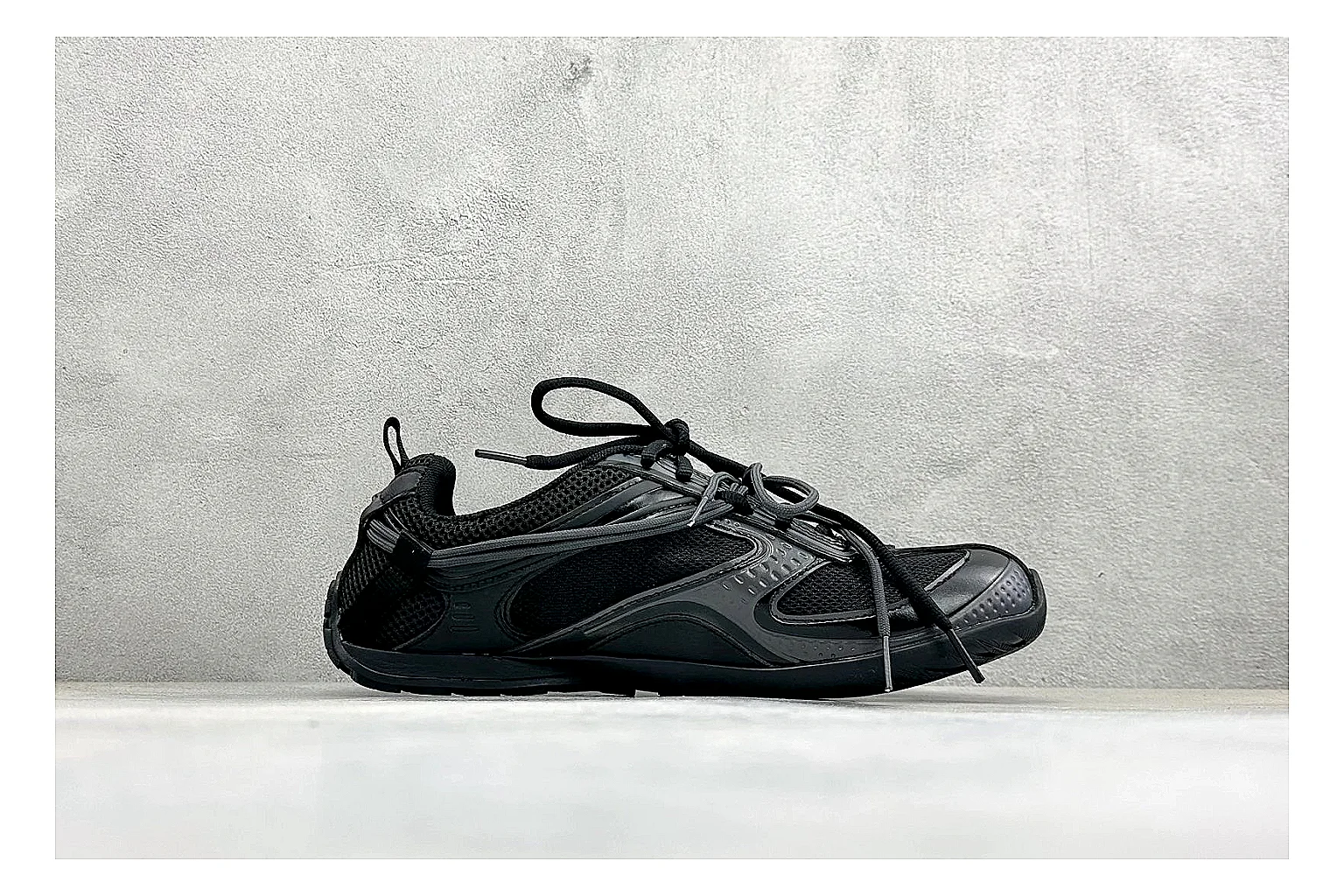 Balenciaga Track Black Low-Top comparison photo showing black layered technical upper, complex paneling, chunky runner sole, and tactical low-top shape thumbnail 6