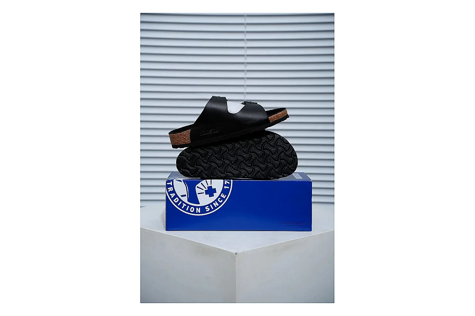 Birkenstock Arizona Black Cork Slide comparison signal image with adjustable buckles, contoured footbed and dark outsole for versatile casual looks