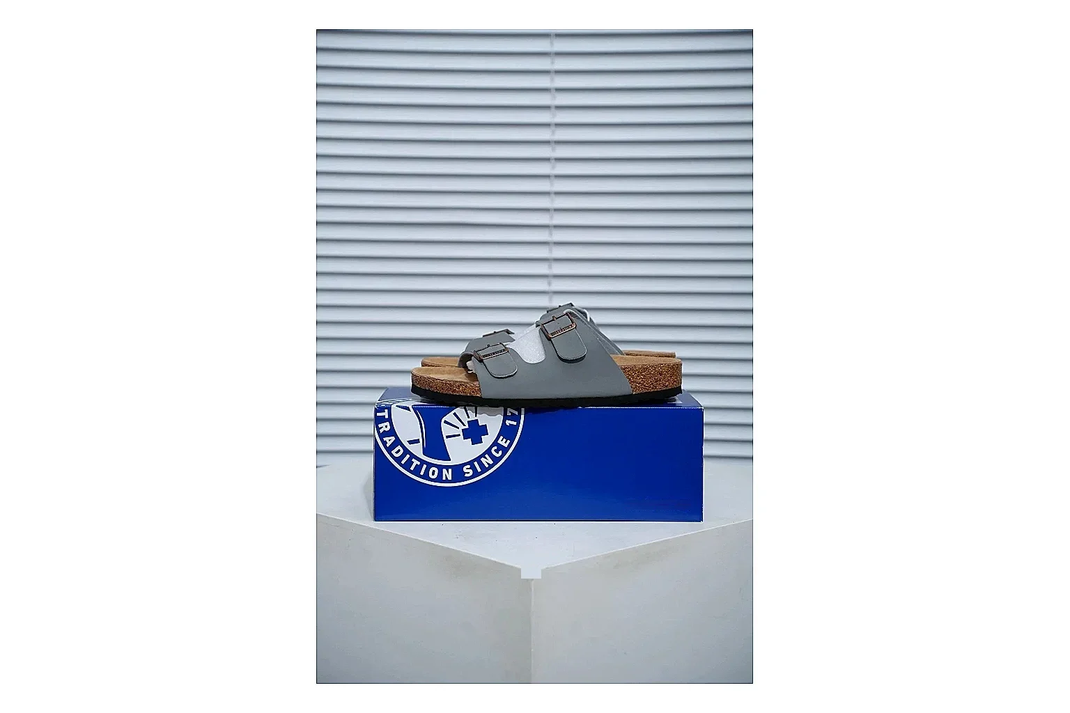 Birkenstock Arizona Charcoal Cork Slide comparison signal image with adjustable buckles, molded cork footbed and dark outsole for understated everyday style