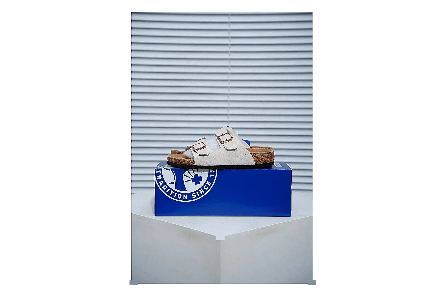 Birkenstock Arizona Cream Cork Slide comparison signal image with adjustable buckles, soft neutral upper and contoured footbed for easy casual wear