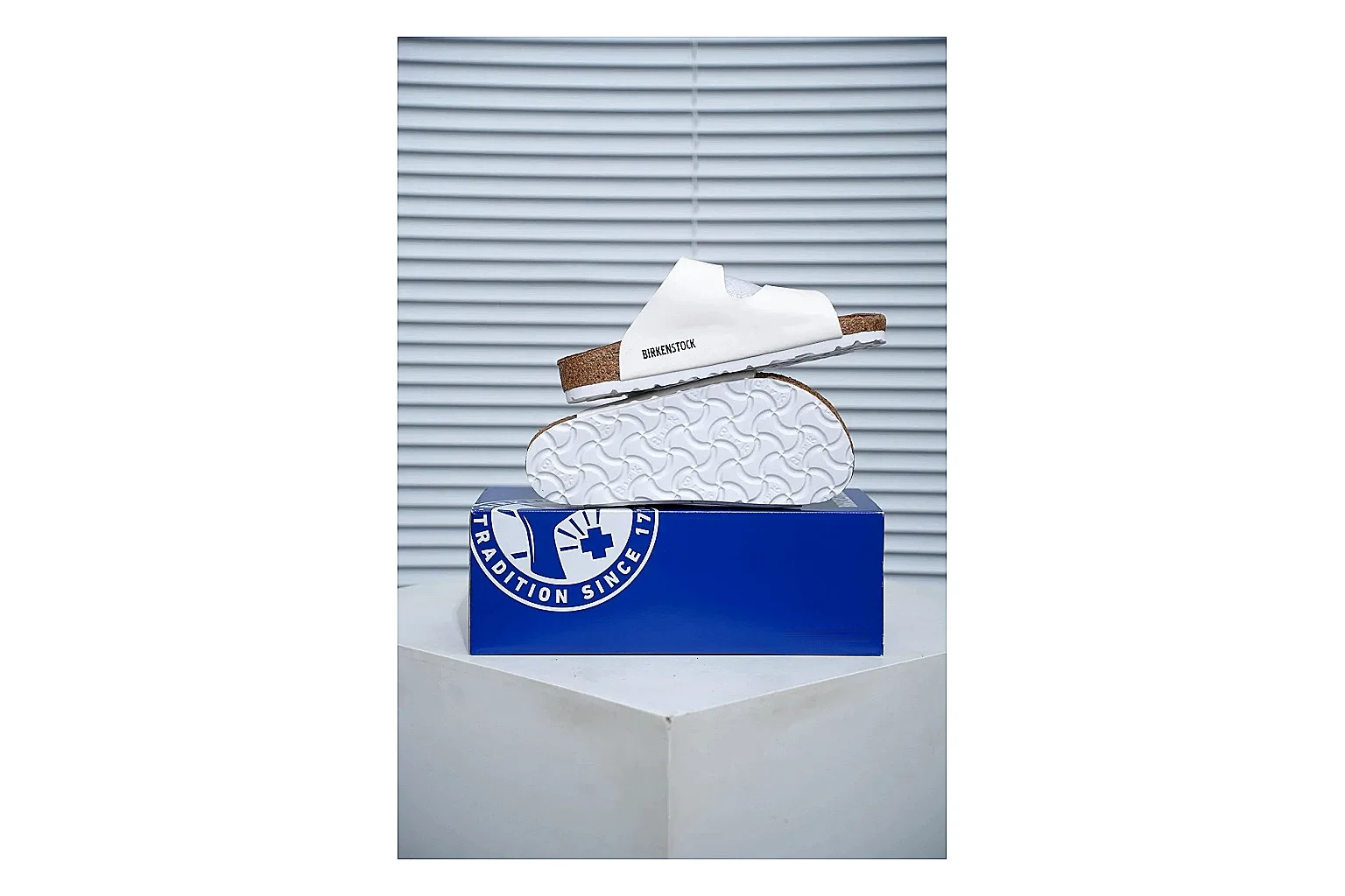Birkenstock Arizona White Cork Slide comparison signal image with adjustable buckles, contoured footbed and black outsole for clean summer casual styling