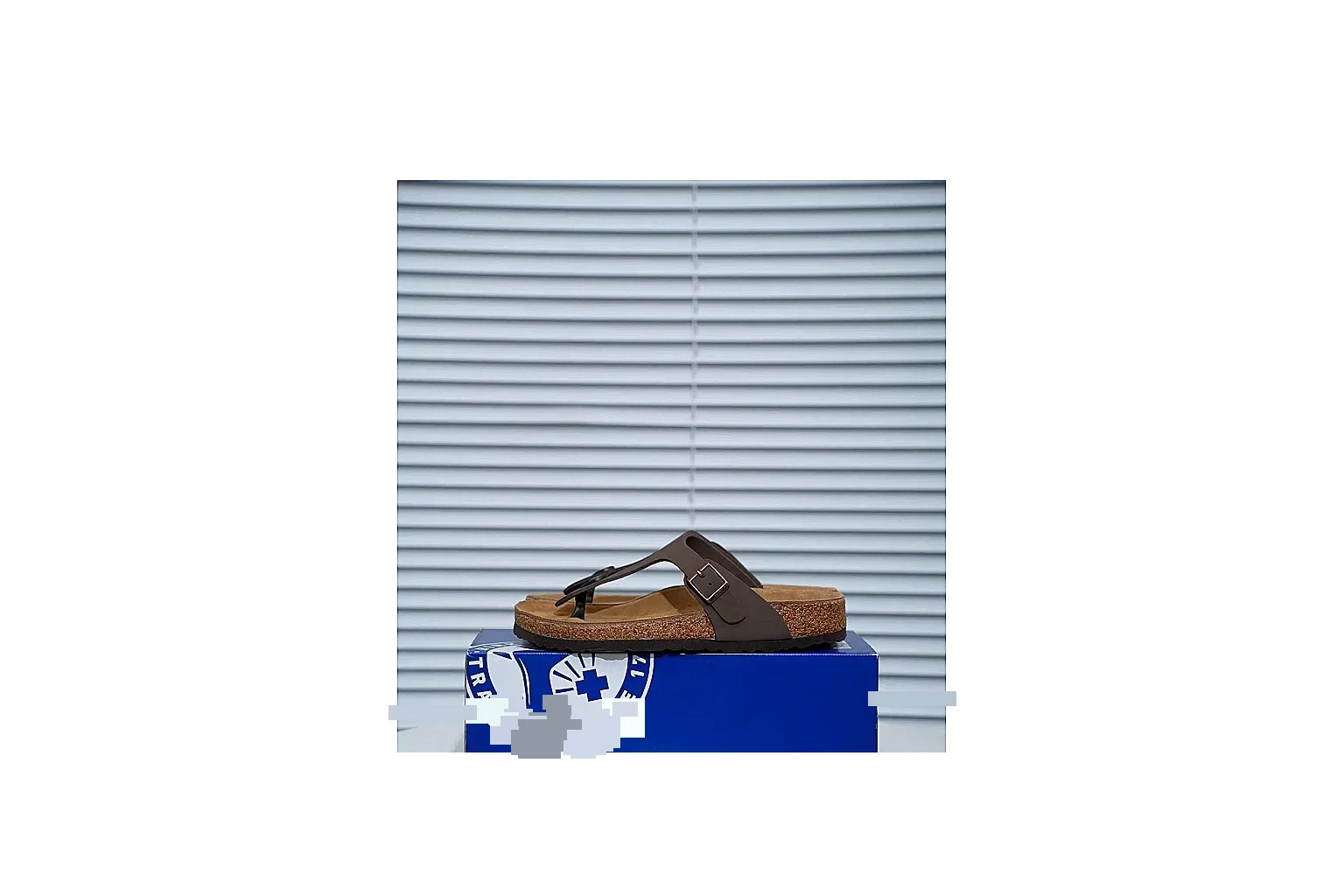 Birkenstock Brown Buckle Cork Slide comparison signal image with wide strap, large metal buckle and contoured footbed for classic relaxed styling