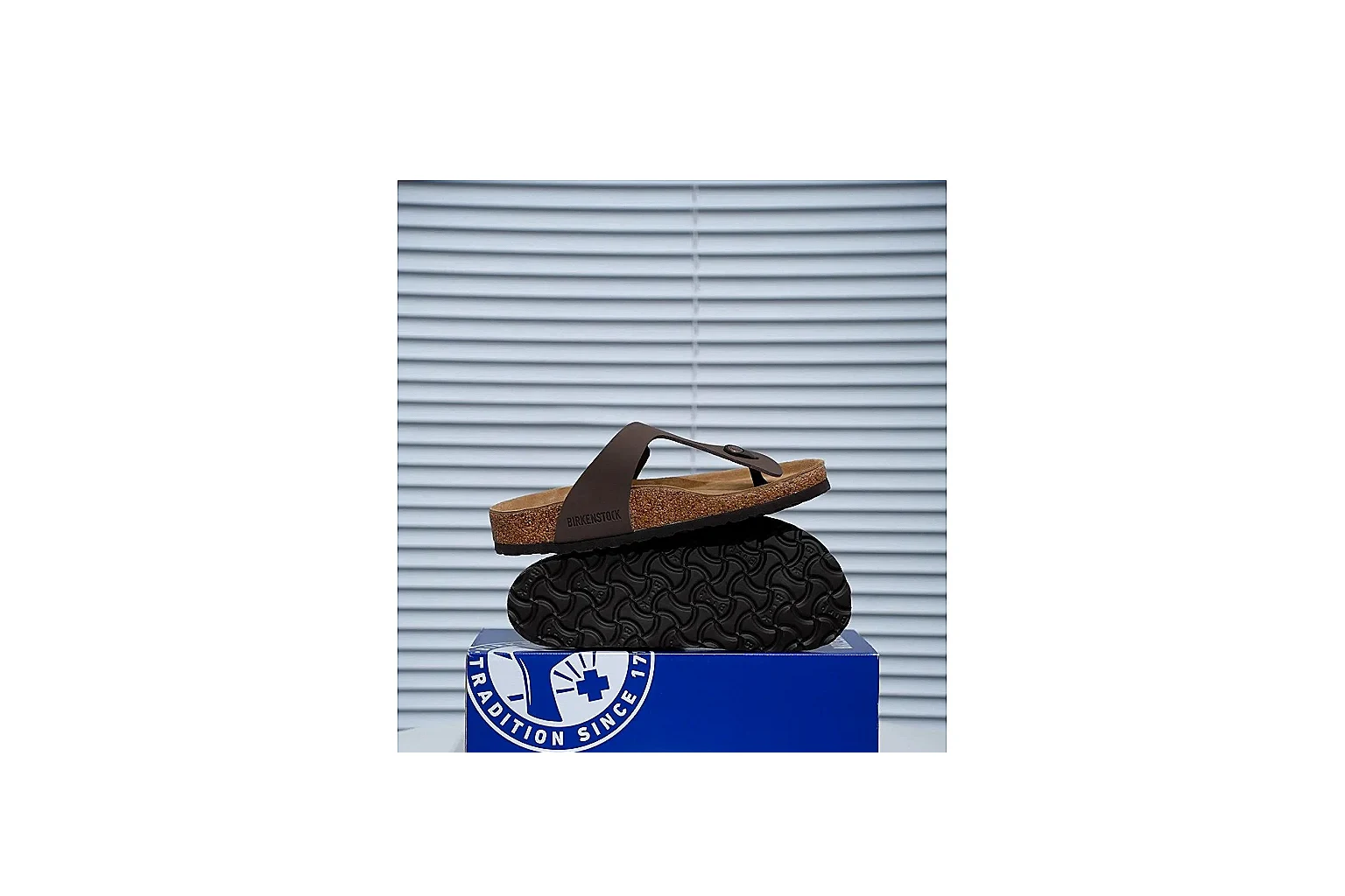Birkenstock Brown Buckle Cork Slide comparison signal image with wide strap, large metal buckle and contoured footbed for classic relaxed styling