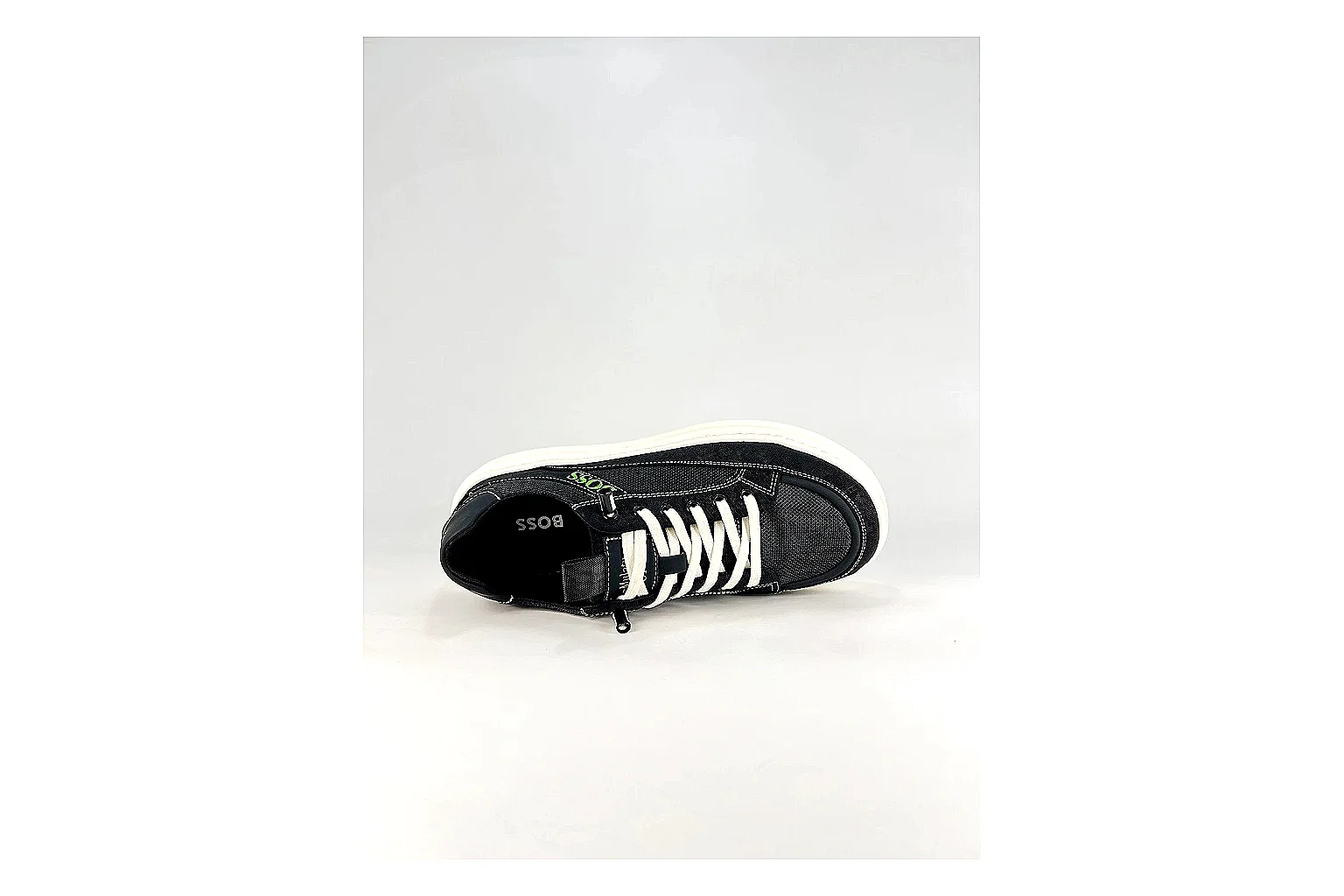 Boss Low Top Black White comparison photo showing black white leather low-top upper, minimal casual profile, clean panels, and simple rubber sole thumbnail 5