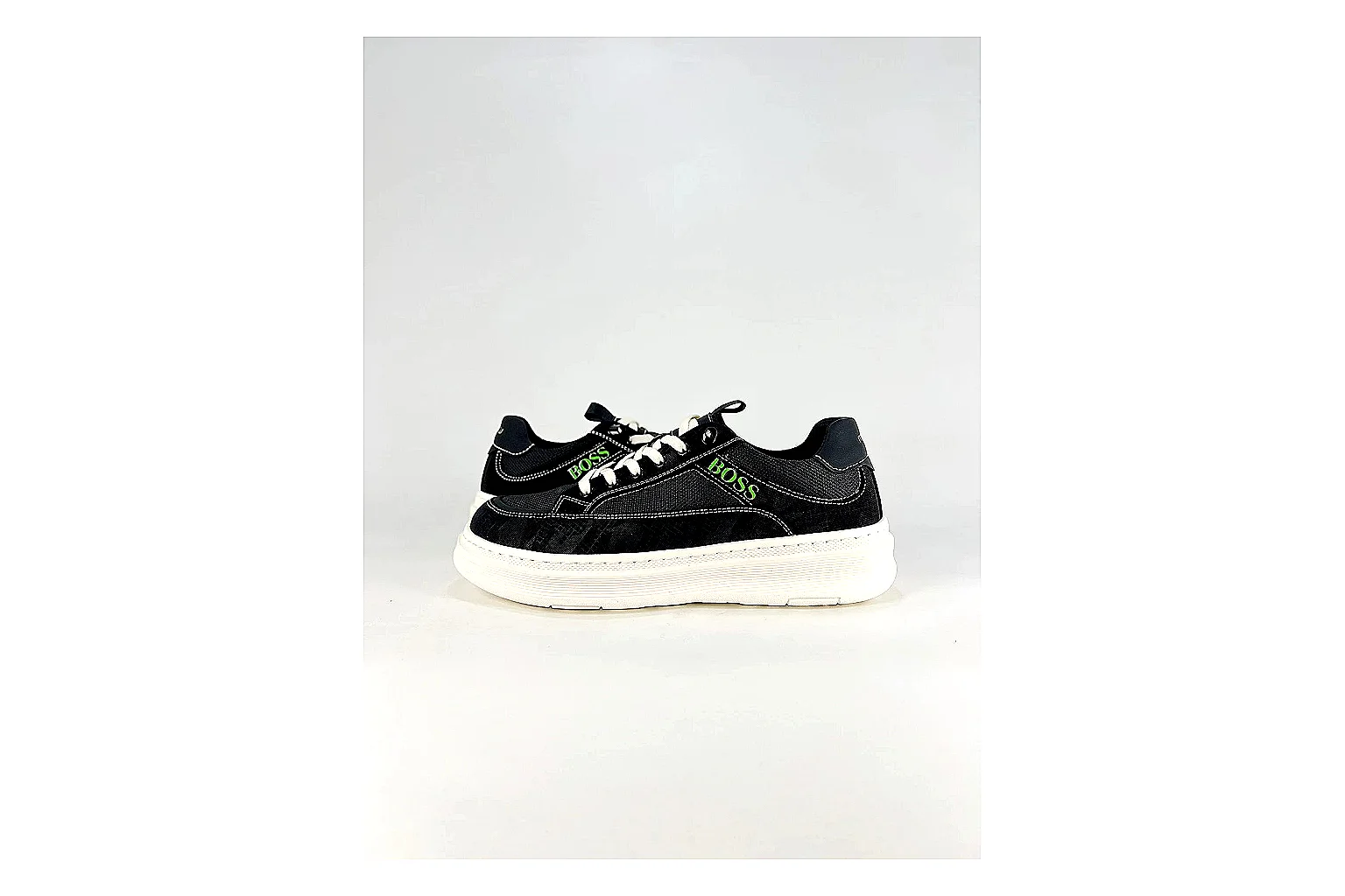 Boss Low Top Black White comparison photo showing black white leather low-top upper, minimal casual profile, clean panels, and simple rubber sole thumbnail 6