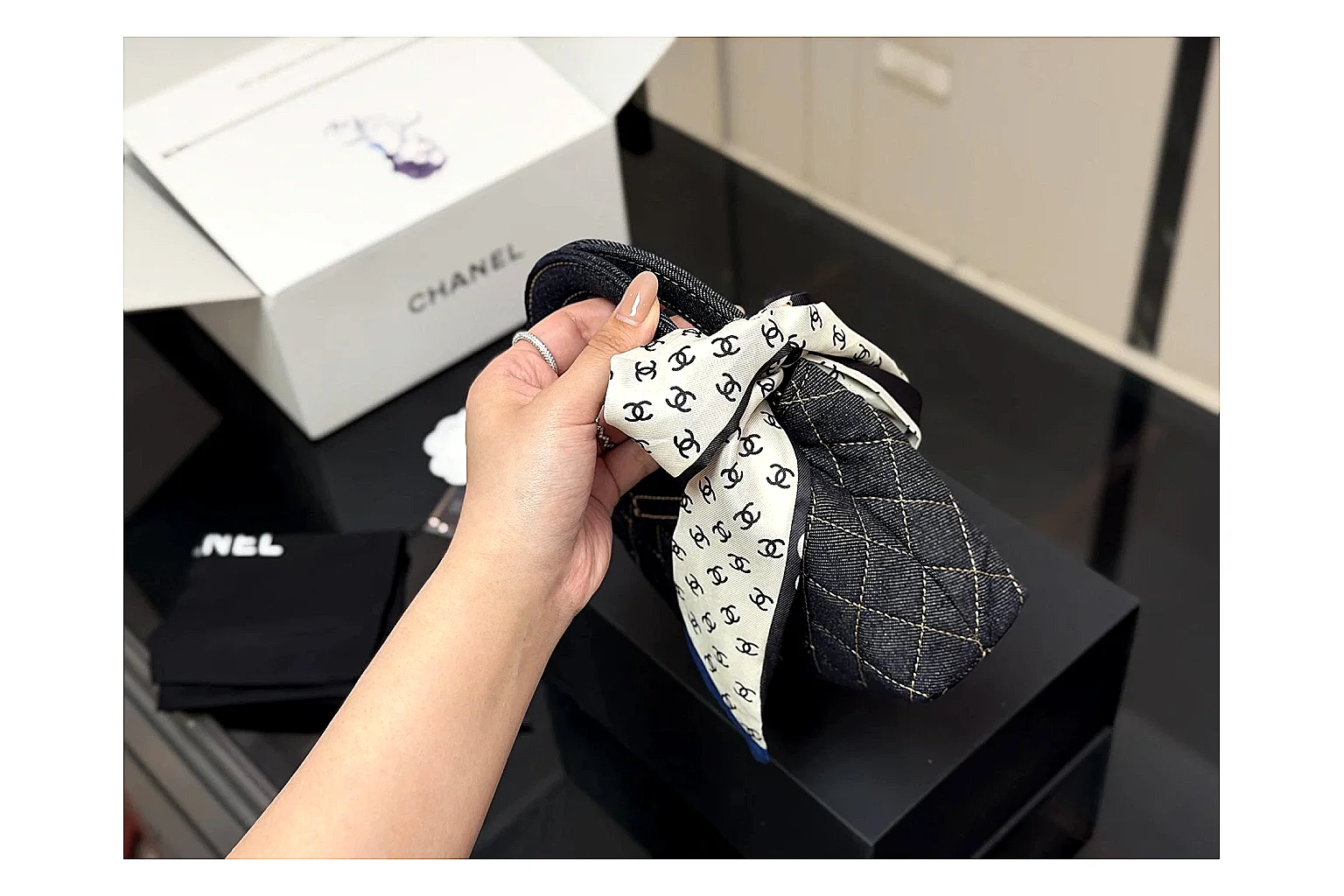Chanel Quilted Chain Bag Black comparison photo showing black quilted leather body, chain strap, flap profile, and polished luxury hardware thumbnail 3