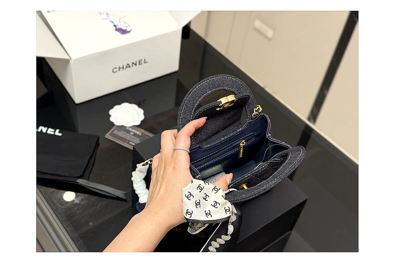 Chanel Quilted Chain Bag Black comparison photo showing black quilted leather body, chain strap, flap profile, and polished luxury hardware thumbnail 4