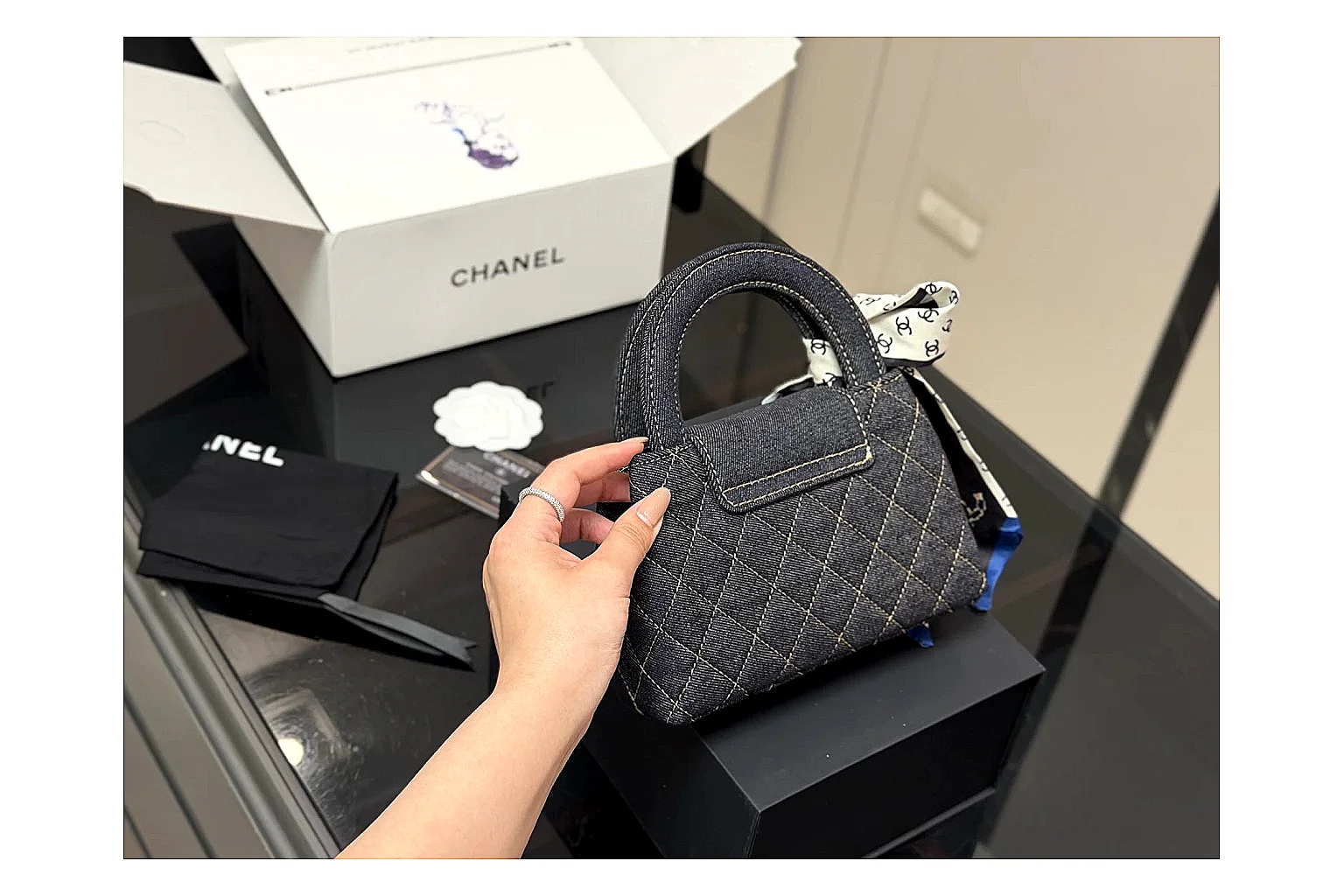 Chanel Quilted Chain Bag Black comparison photo showing black quilted leather body, chain strap, flap profile, and polished luxury hardware thumbnail 5