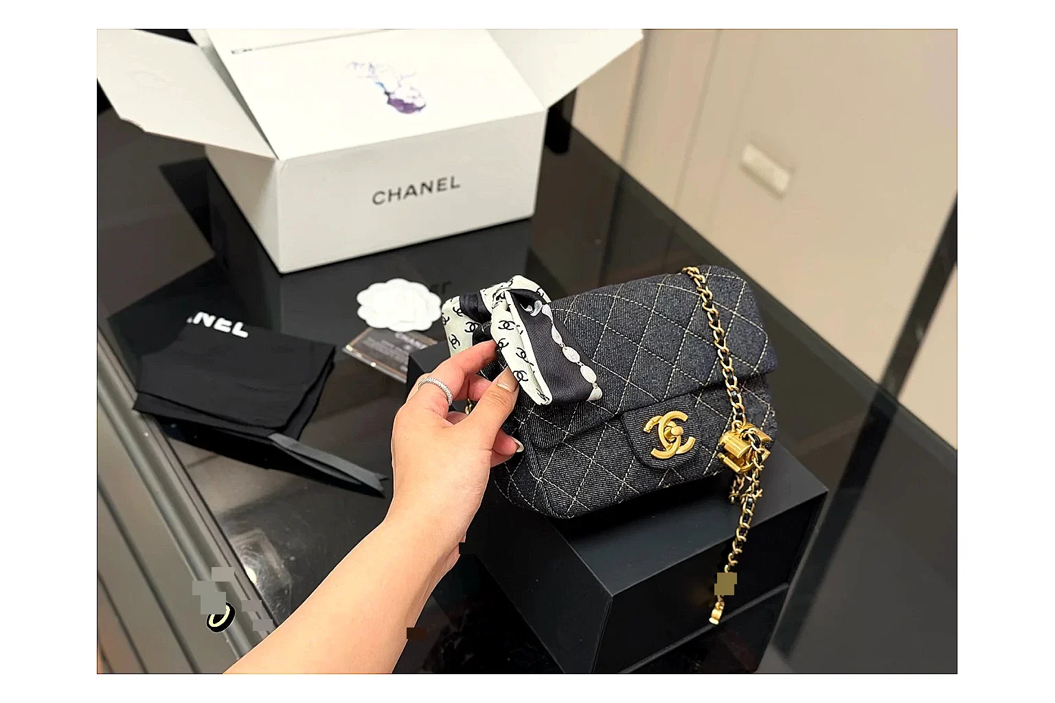 Chanel Quilted Chain Bag Black comparison photo showing black quilted leather body, chain shoulder strap, flap structure, and polished hardware