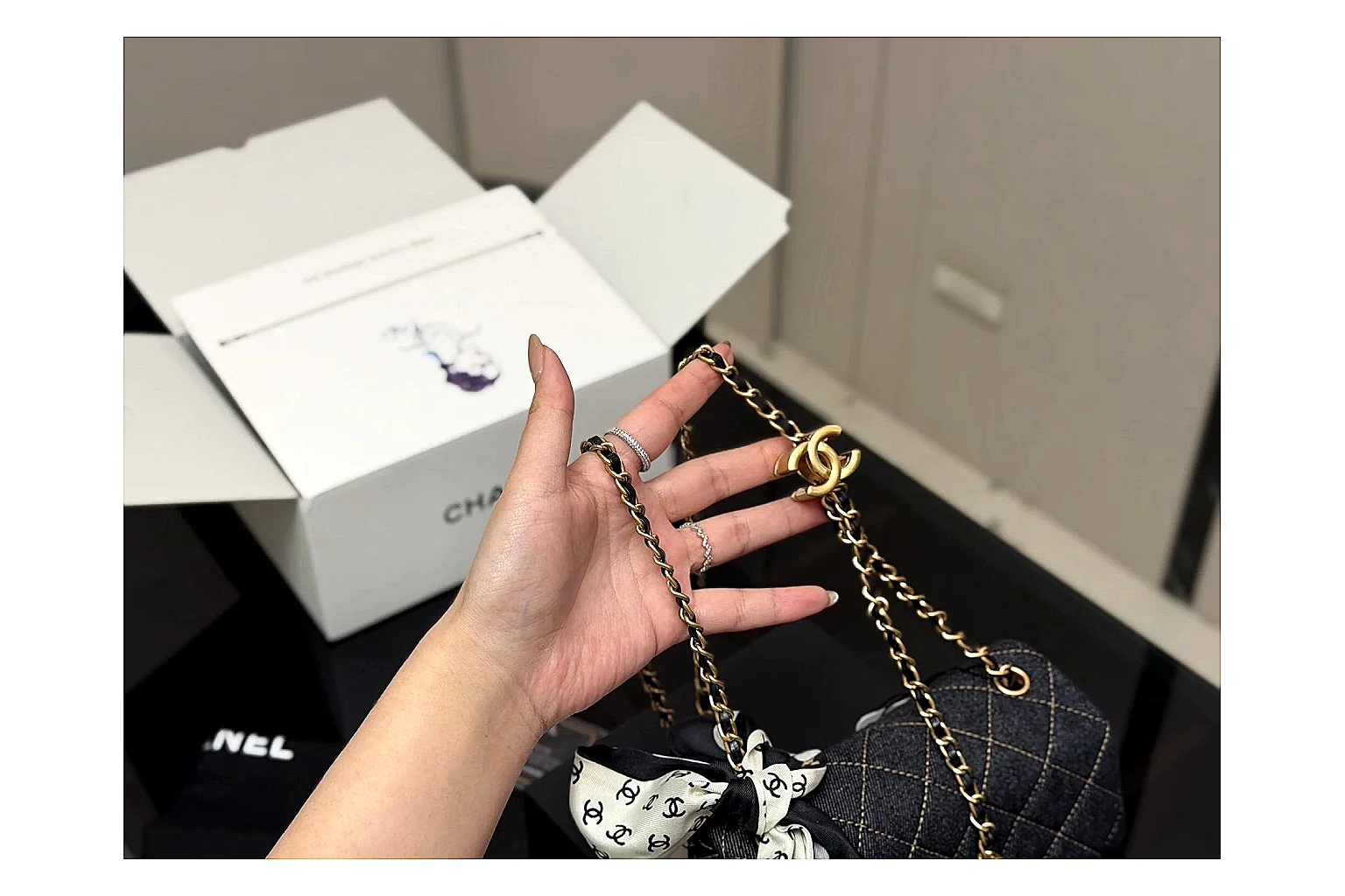 Chanel Quilted Chain Bag Black comparison photo showing black quilted leather body, chain shoulder strap, flap structure, and polished hardware