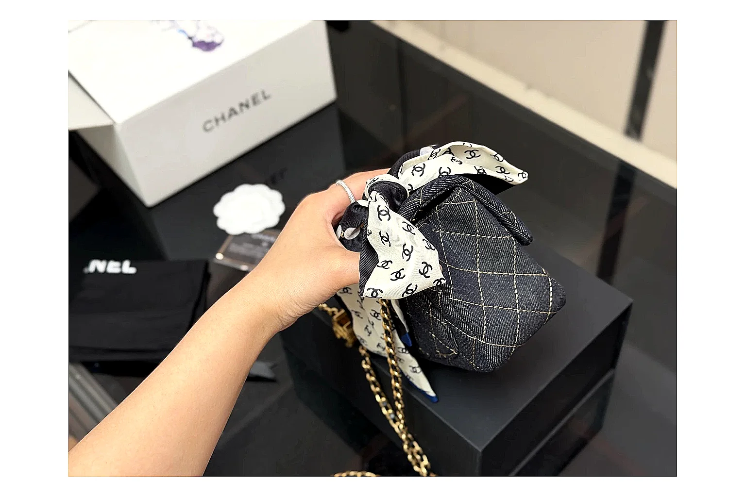 Chanel Quilted Chain Bag Black comparison photo showing black quilted leather body, chain shoulder strap, flap structure, and polished hardware thumbnail 3