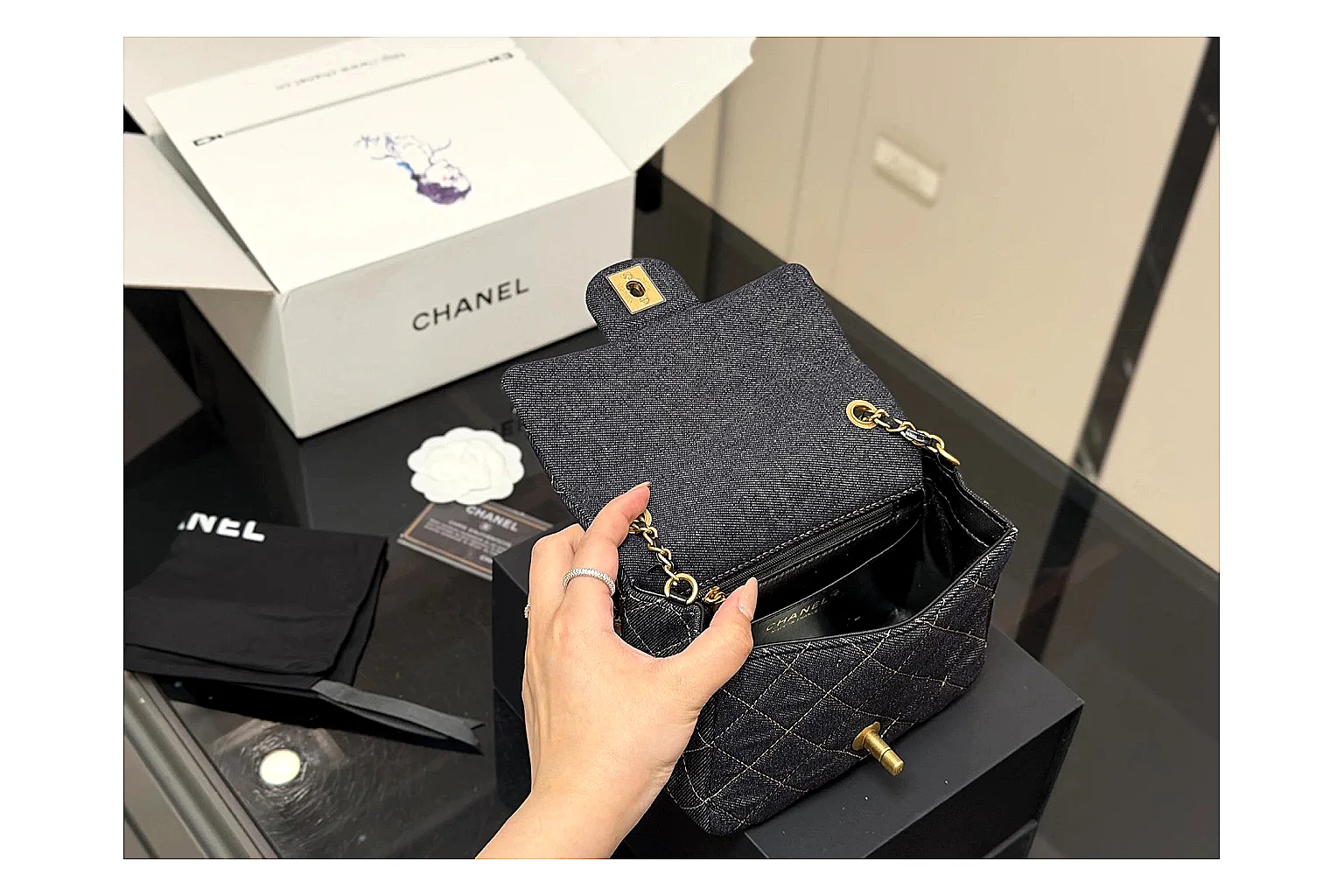 Chanel Quilted Chain Bag Black comparison photo showing black quilted leather body, chain shoulder strap, flap structure, and polished hardware thumbnail 4