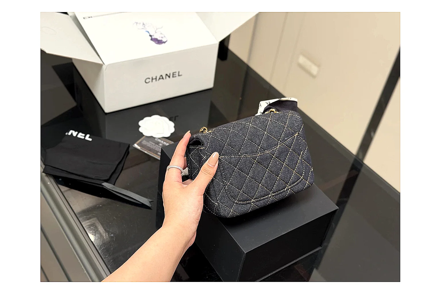 Chanel Quilted Chain Bag Black comparison photo showing black quilted leather body, chain shoulder strap, flap structure, and polished hardware thumbnail 5