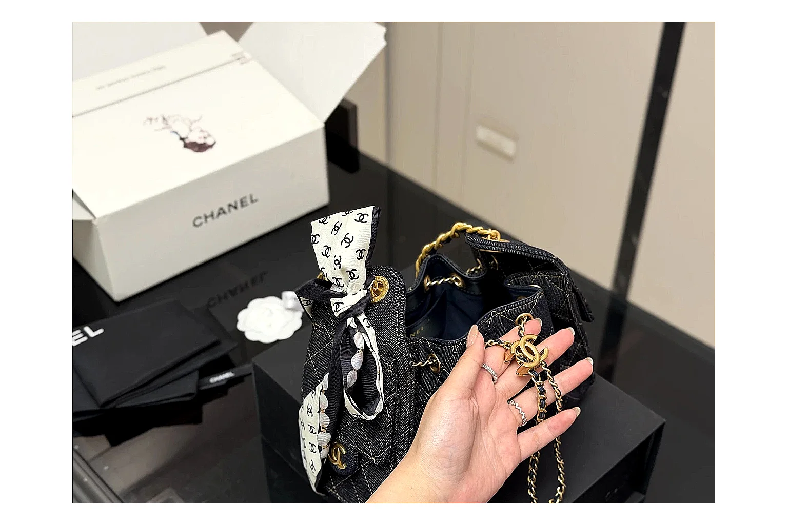 Chanel Quilted Chain Bag Black Blue comparison photo showing black blue quilted leather body, chain shoulder strap, flap structure, and polished luxury-bag hardware thumbnail 2