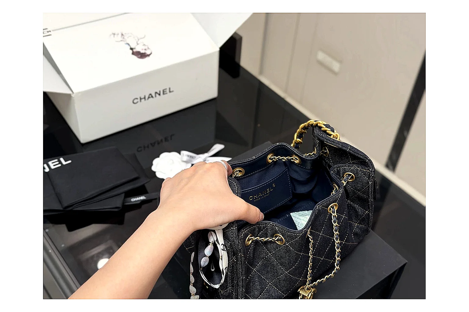 Chanel Quilted Chain Bag Black Blue comparison photo showing black blue quilted leather body, chain shoulder strap, flap structure, and polished luxury-bag hardware thumbnail 4