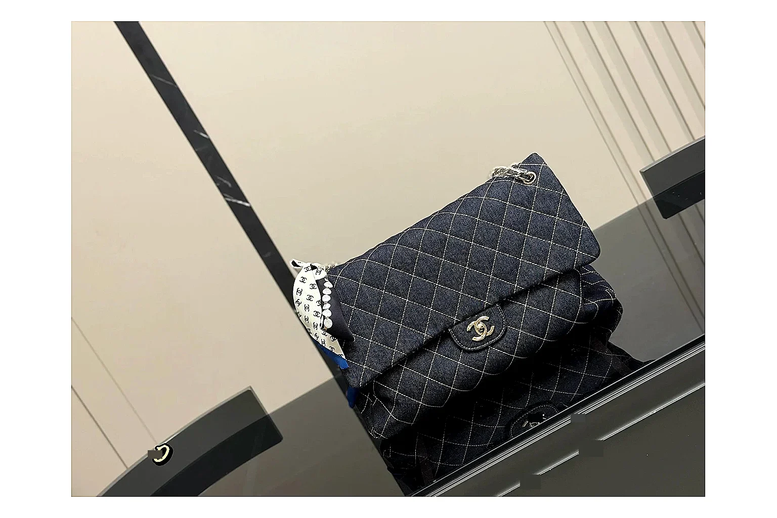 Chanel Quilted Flap Bag Black Denim comparison photo showing black denim-look quilted flap body, shoulder-bag shape, chain strap, and polished hardware
