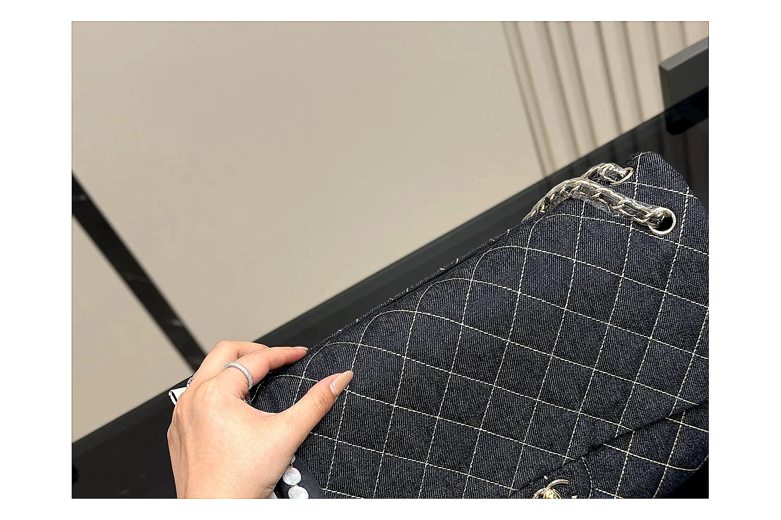 Chanel Quilted Flap Bag Black Denim comparison photo showing black denim-look quilted flap body, shoulder-bag shape, chain strap, and polished hardware
