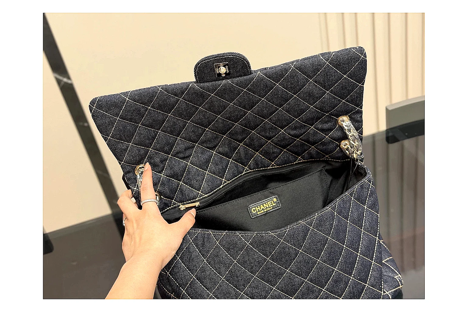 Chanel Quilted Flap Bag Black Denim comparison photo showing black denim-look quilted flap body, shoulder-bag shape, chain strap, and polished hardware thumbnail 4